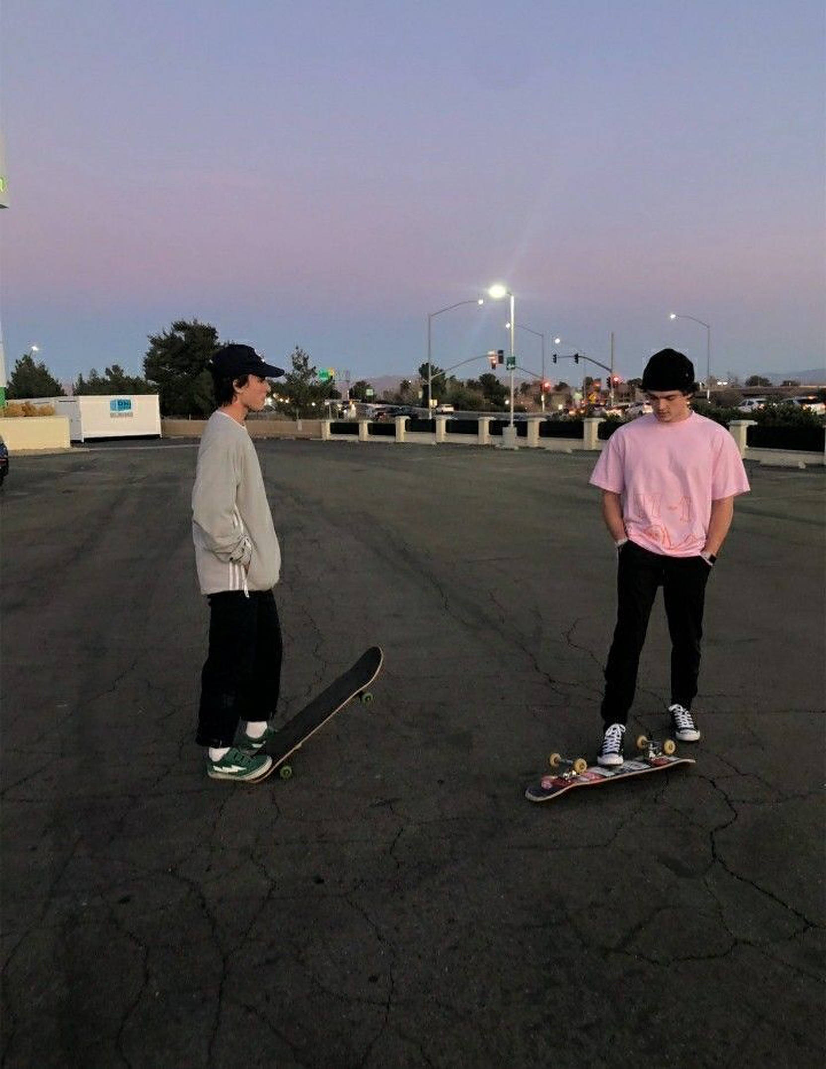 skateboarders, cracked parking lot, dusk, Full HD Phone Wallpaper