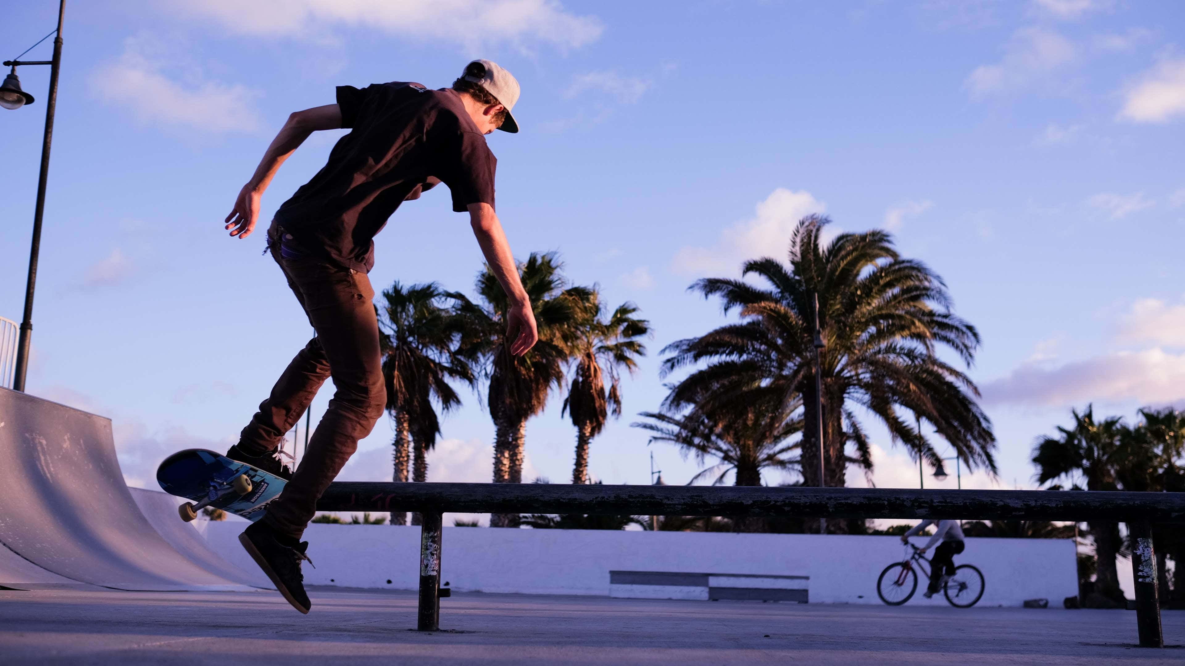 skateboarder, rail, sunset, 4K Desktop Wallpaper