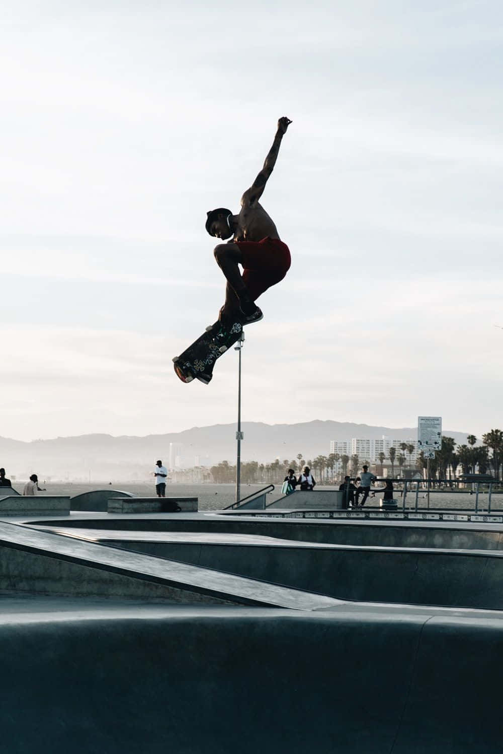 skateboarder, concrete skatepark, hazy coastal backdrop, HD Phone Wallpaper