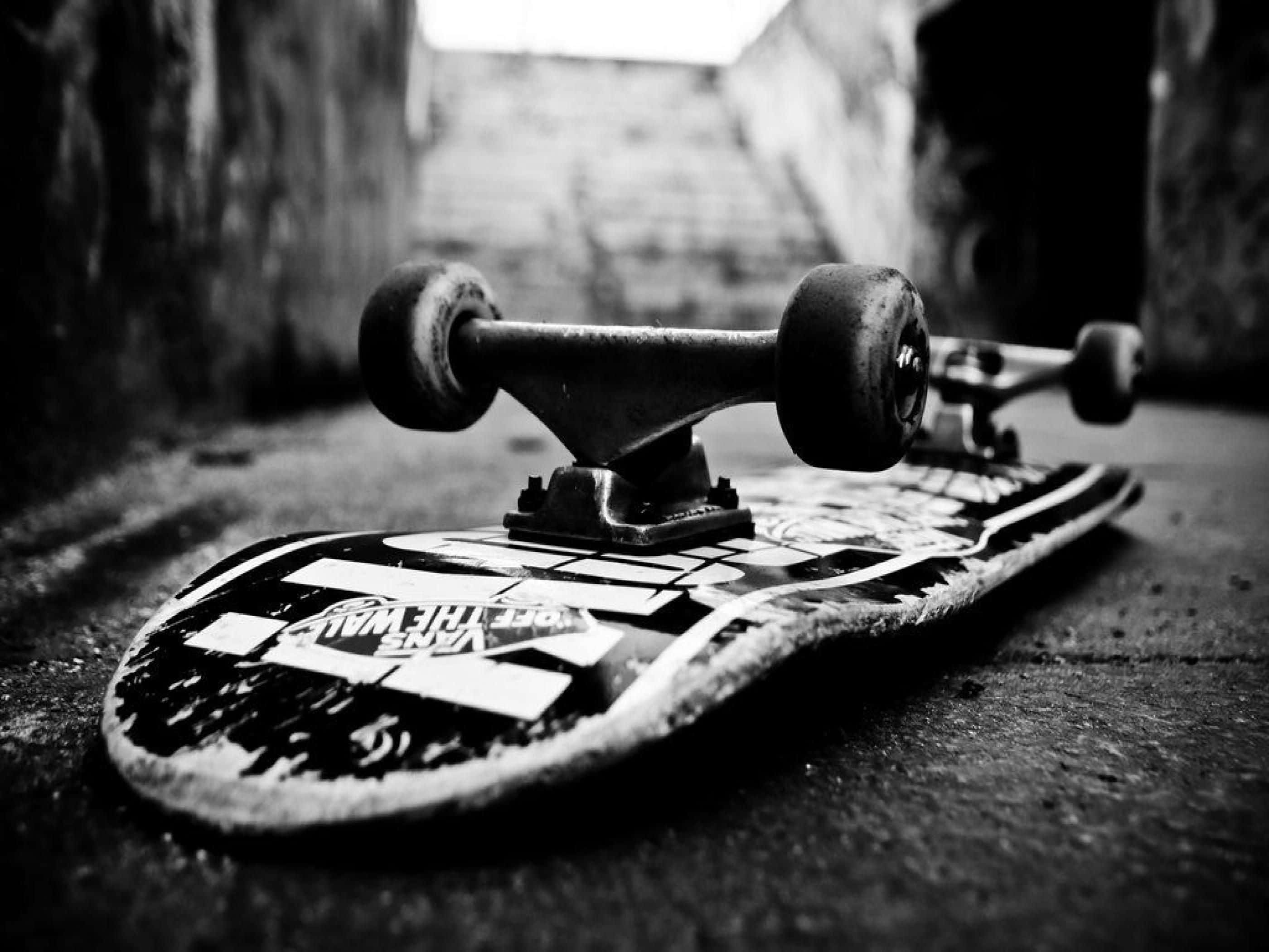 skateboard, gritty pavement, shadowed alleyway, 2K Desktop Wallpaper