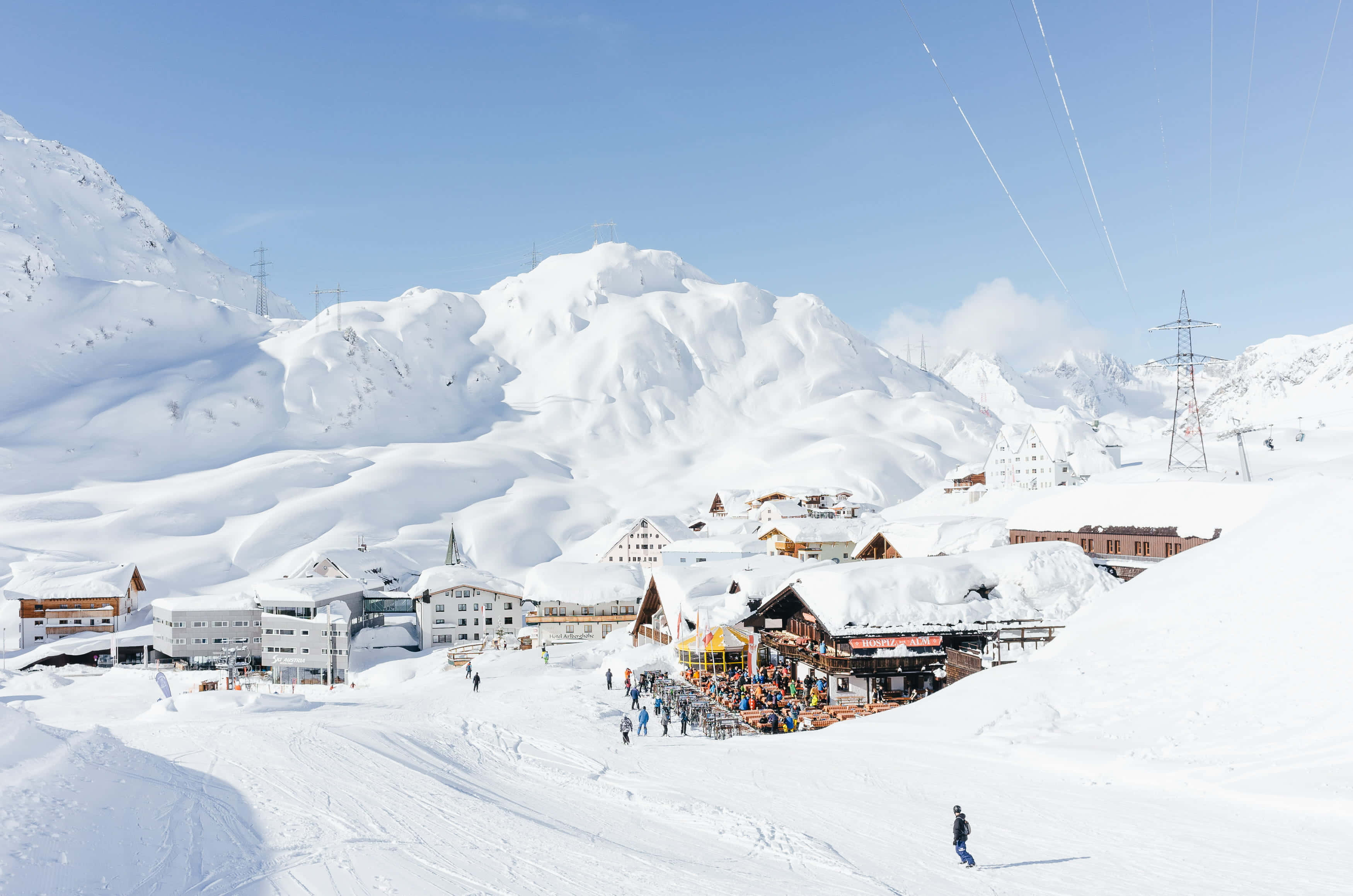 ski resort, snow-covered mountains, clear blue sky, 2K Desktop Wallpaper