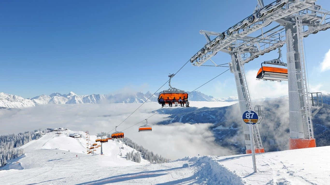 Ski Resort, bright orange ski lift gondolas, snow-covered mountains, HD Desktop Wallpaper