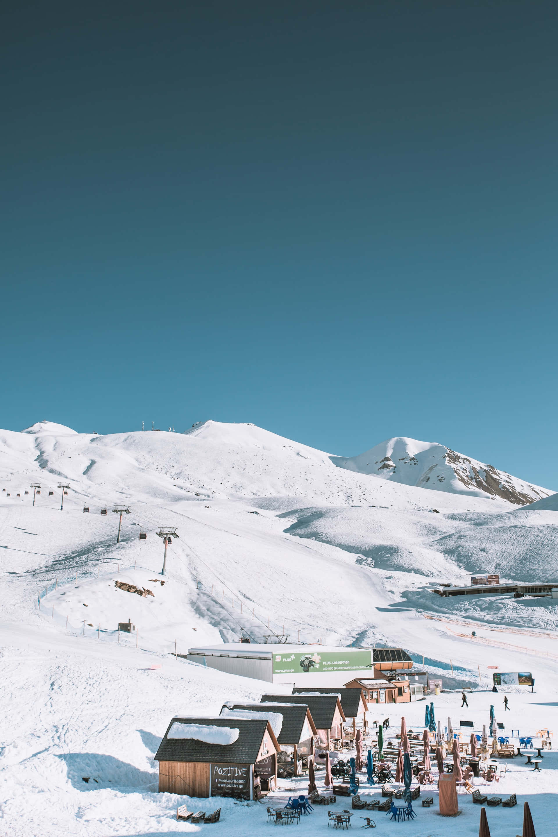 Ski resort, snowy mountain, wooden chalets, 2K Phone Wallpaper