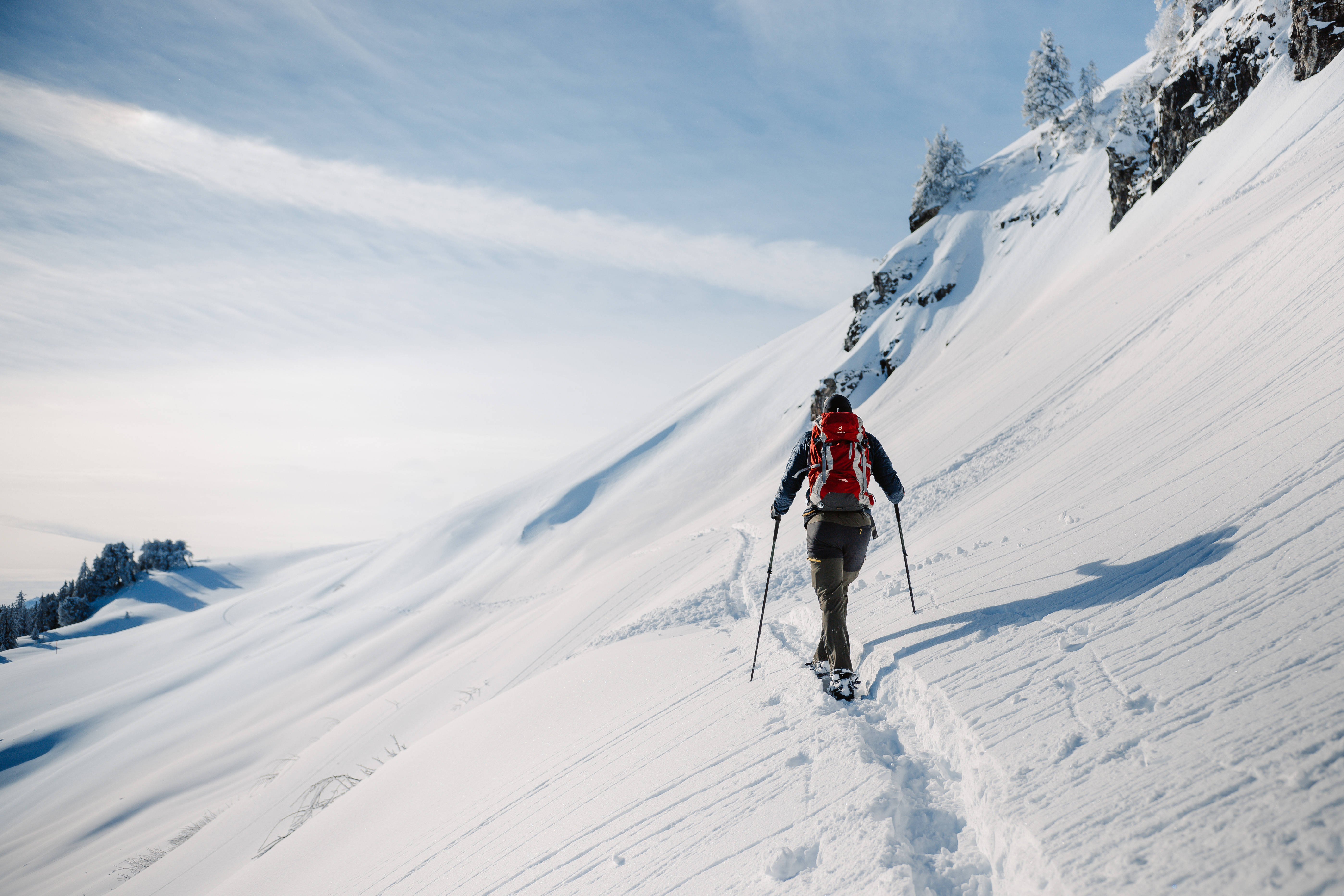 red backpack, sunlit snowy mountain slope, vast blue sky, 5K Desktop Wallpaper