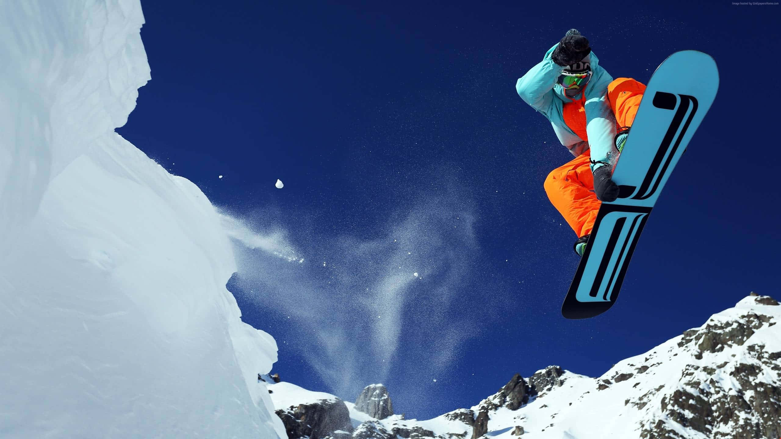 snowboarder, bright orange pants, light blue jacket, 2K Desktop Wallpaper