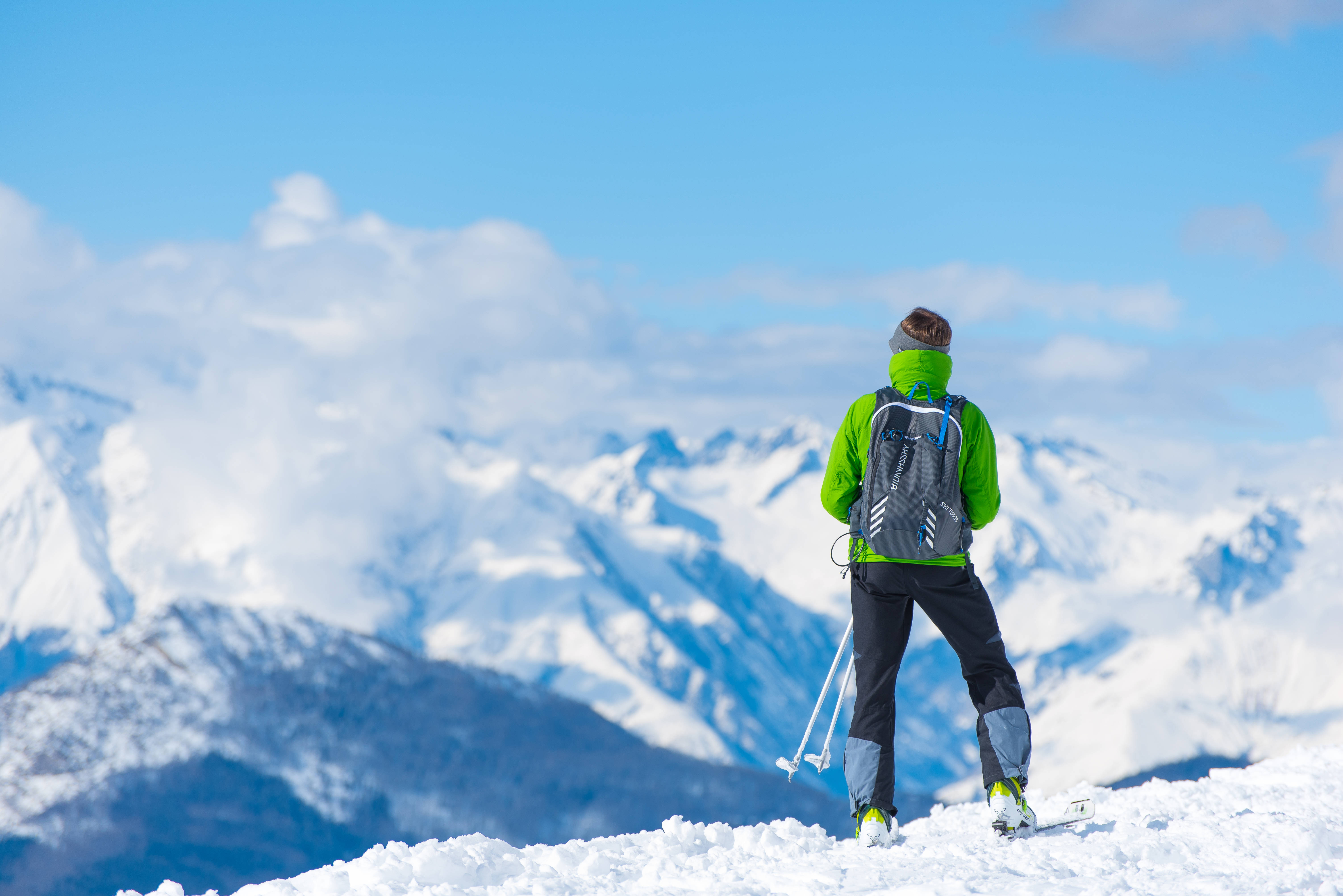 Skiing, bright green gear, snowy peak, 5K Desktop Wallpaper