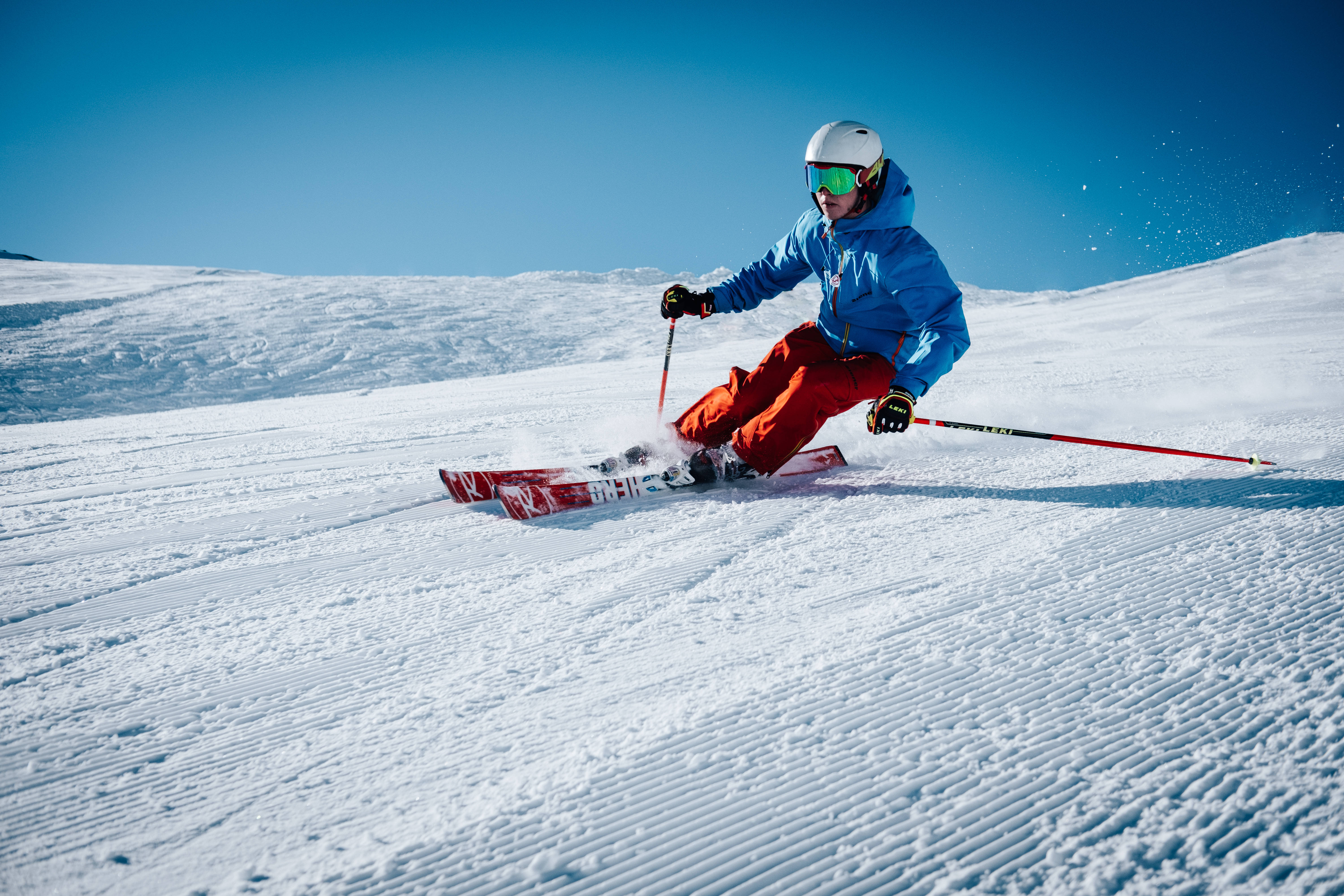 blue jacket, red pants, groomed snowy slope, 5K Desktop Wallpaper