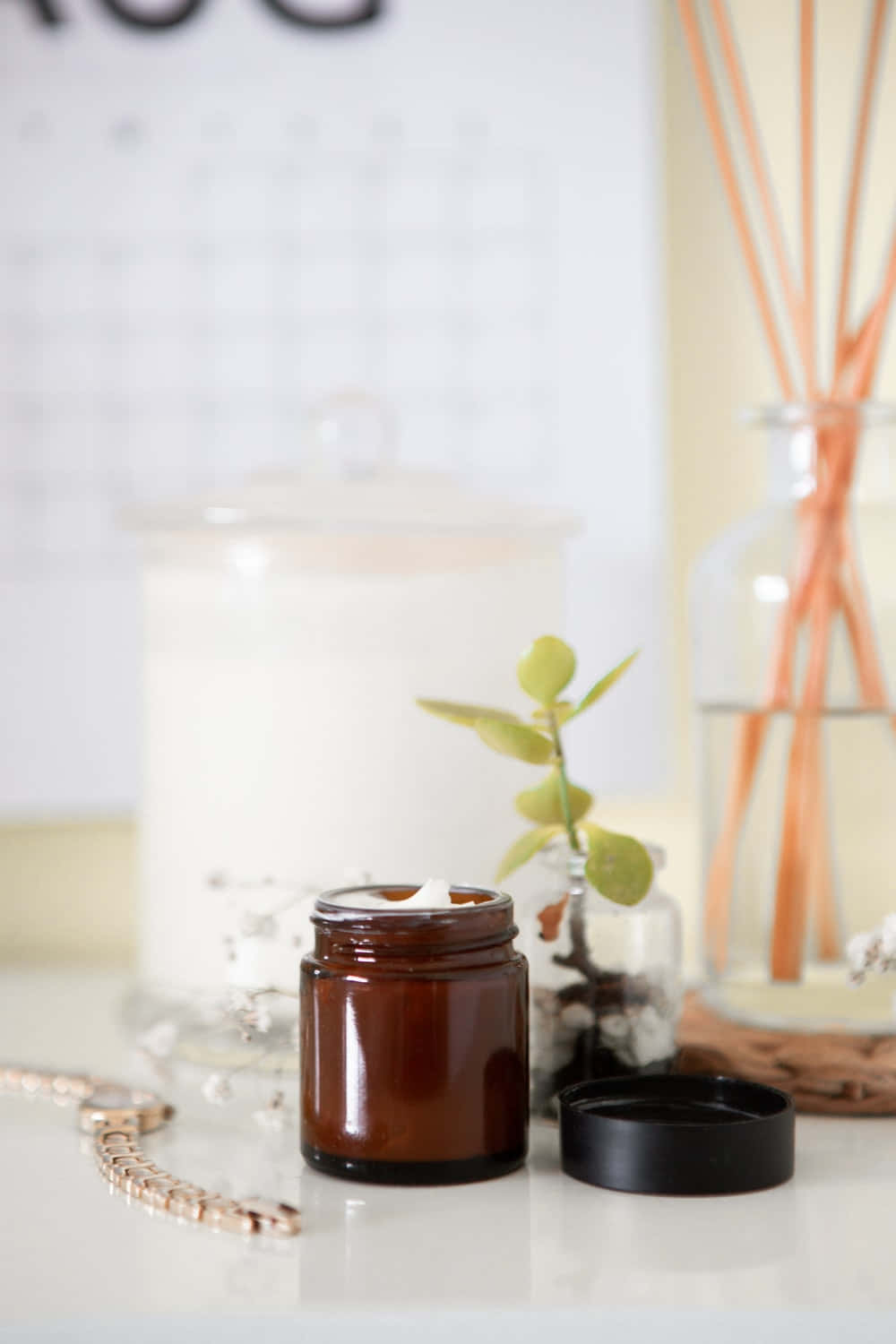 amber jar of cream, small potted plant, glass diffuser with wooden sticks, HD Phone Wallpaper