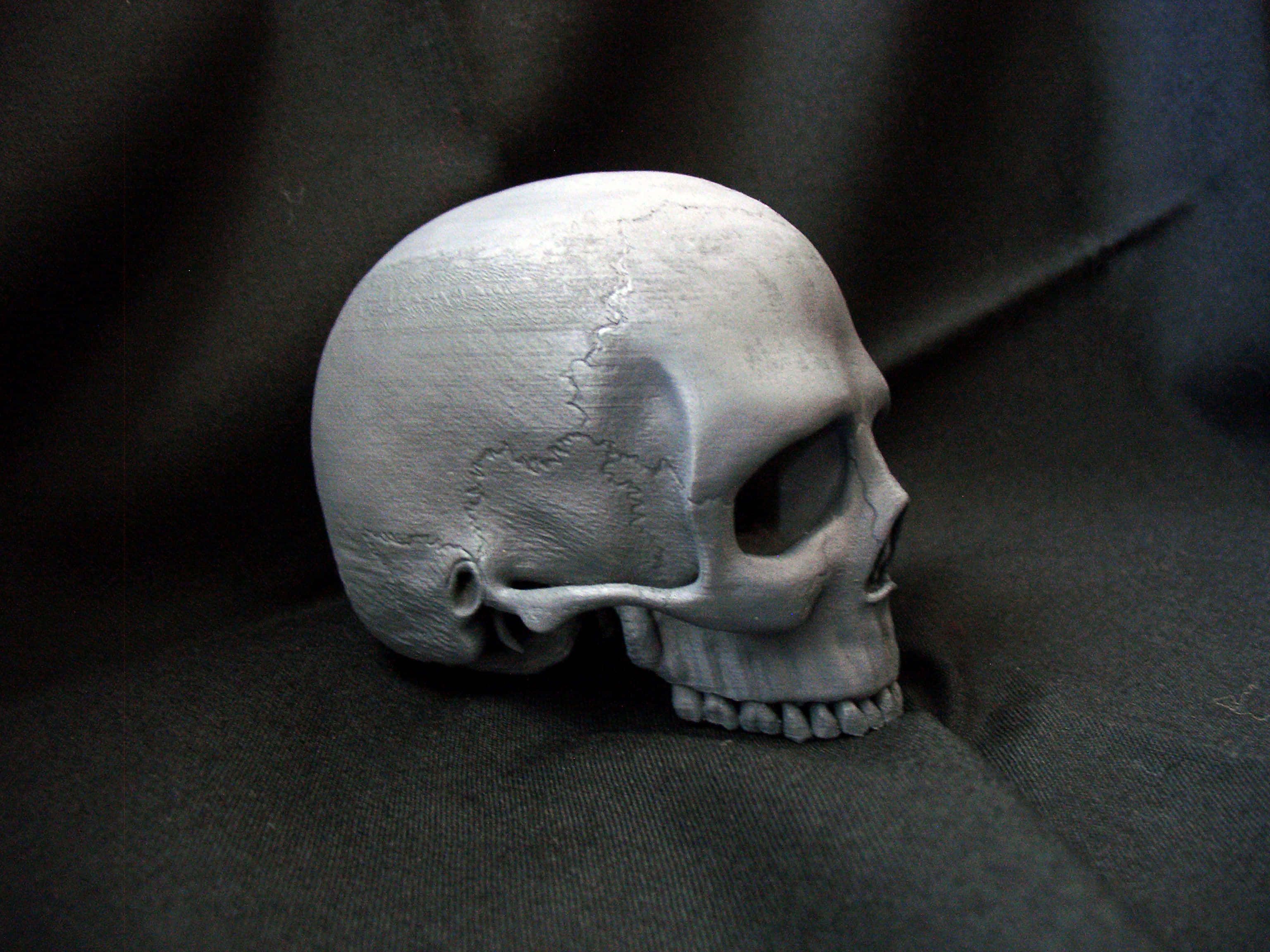 3D Skull, cracked gray skull, dark fabric, 2K Desktop Wallpaper