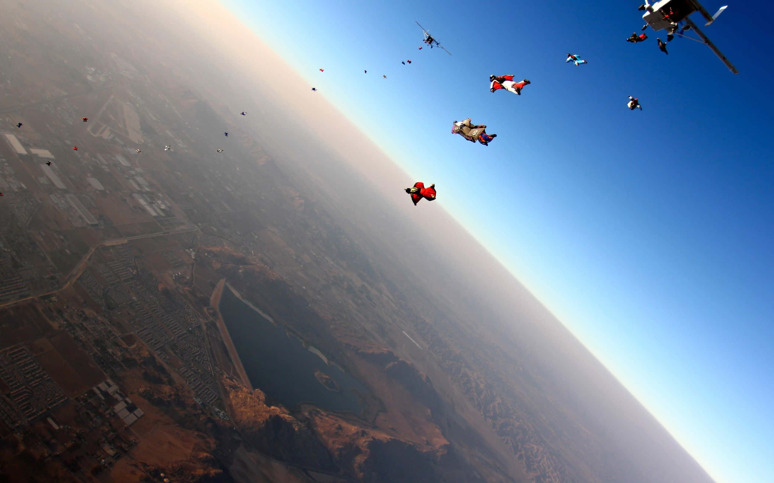wingsuit, red suits, clear blue sky, 2K Desktop Wallpaper
