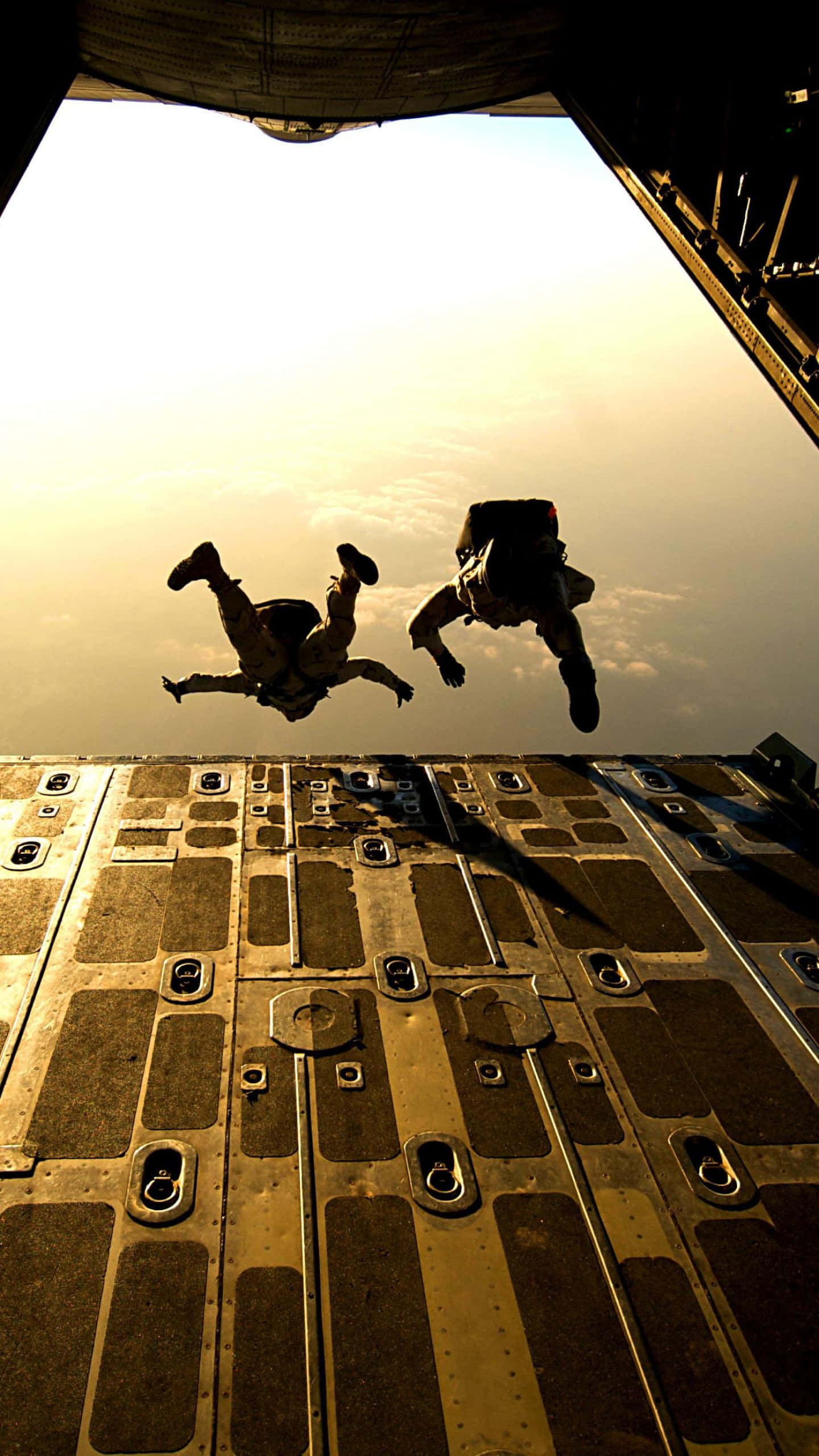 tandem skydiving, open military aircraft hatch, golden sunset sky, 2K Phone Wallpaper