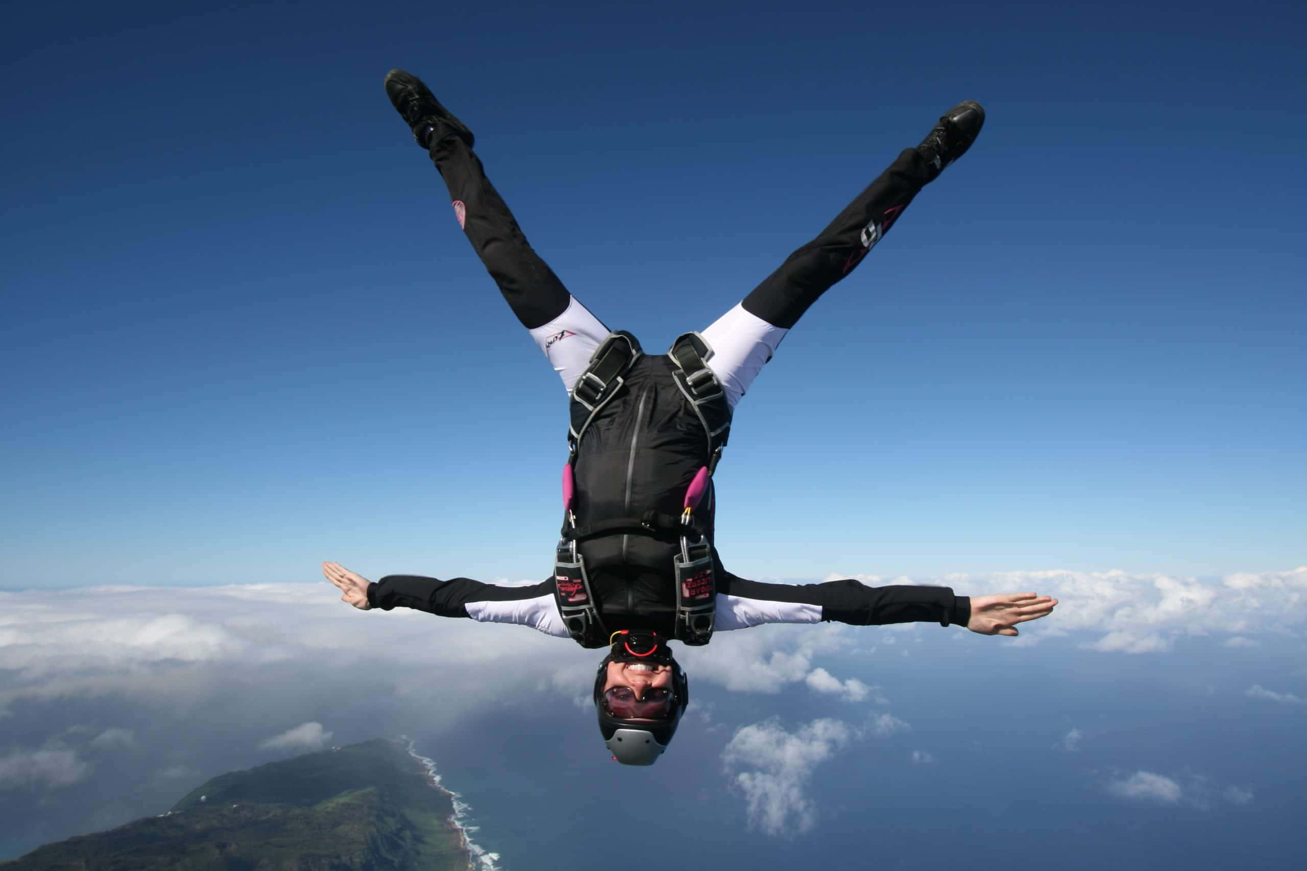 upside down eagle spread, black and white suit, coastal landscape, 2K Desktop Wallpaper