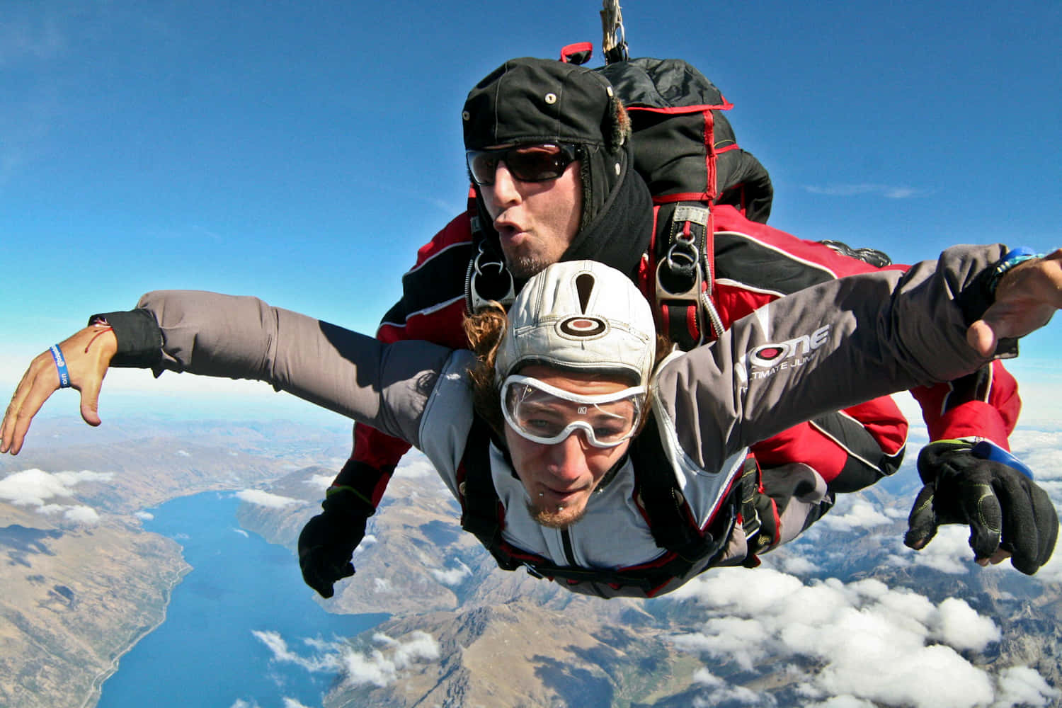 tandem skydiving, clear blue skies, sprawling lake, HD Desktop Wallpaper
