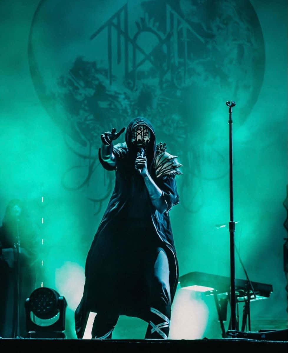 Sleep Token, green stage lights, masked performer, SD Phone Wallpaper