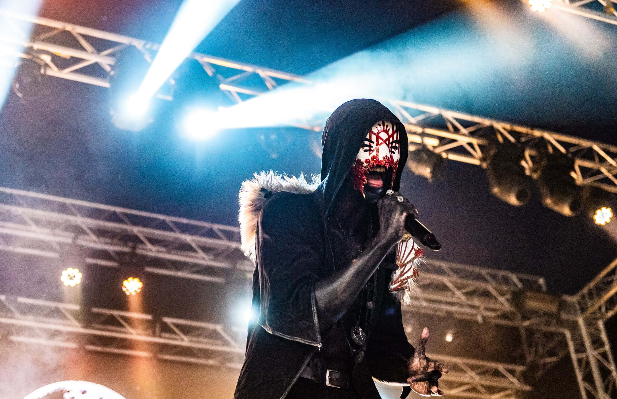 masked performer, black hooded outfit, blue lights, Full HD Desktop Wallpaper