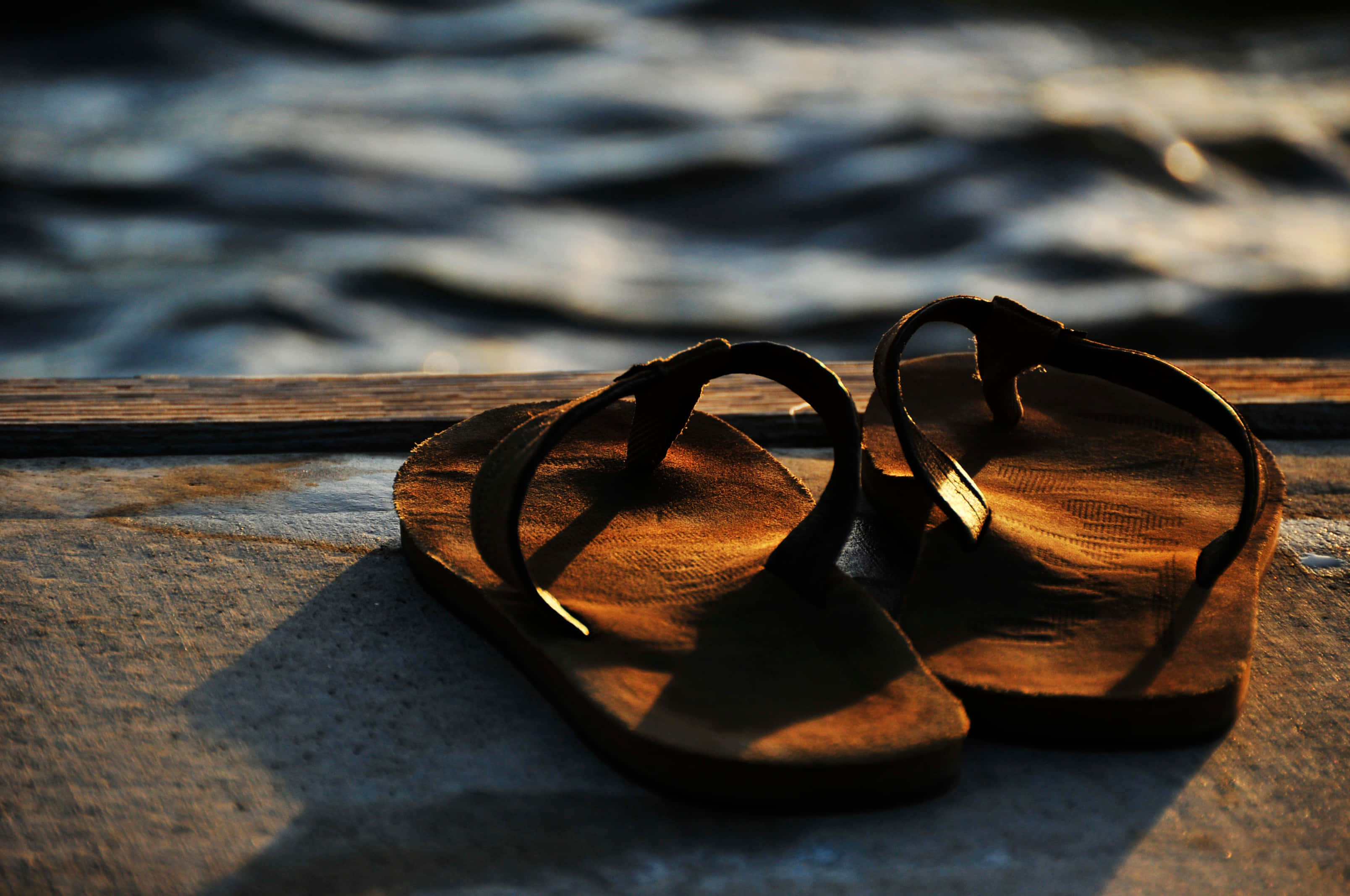 Sunset Flip Flopsby Water, wooden flip flops, weathered dock, 2K Desktop Wallpaper