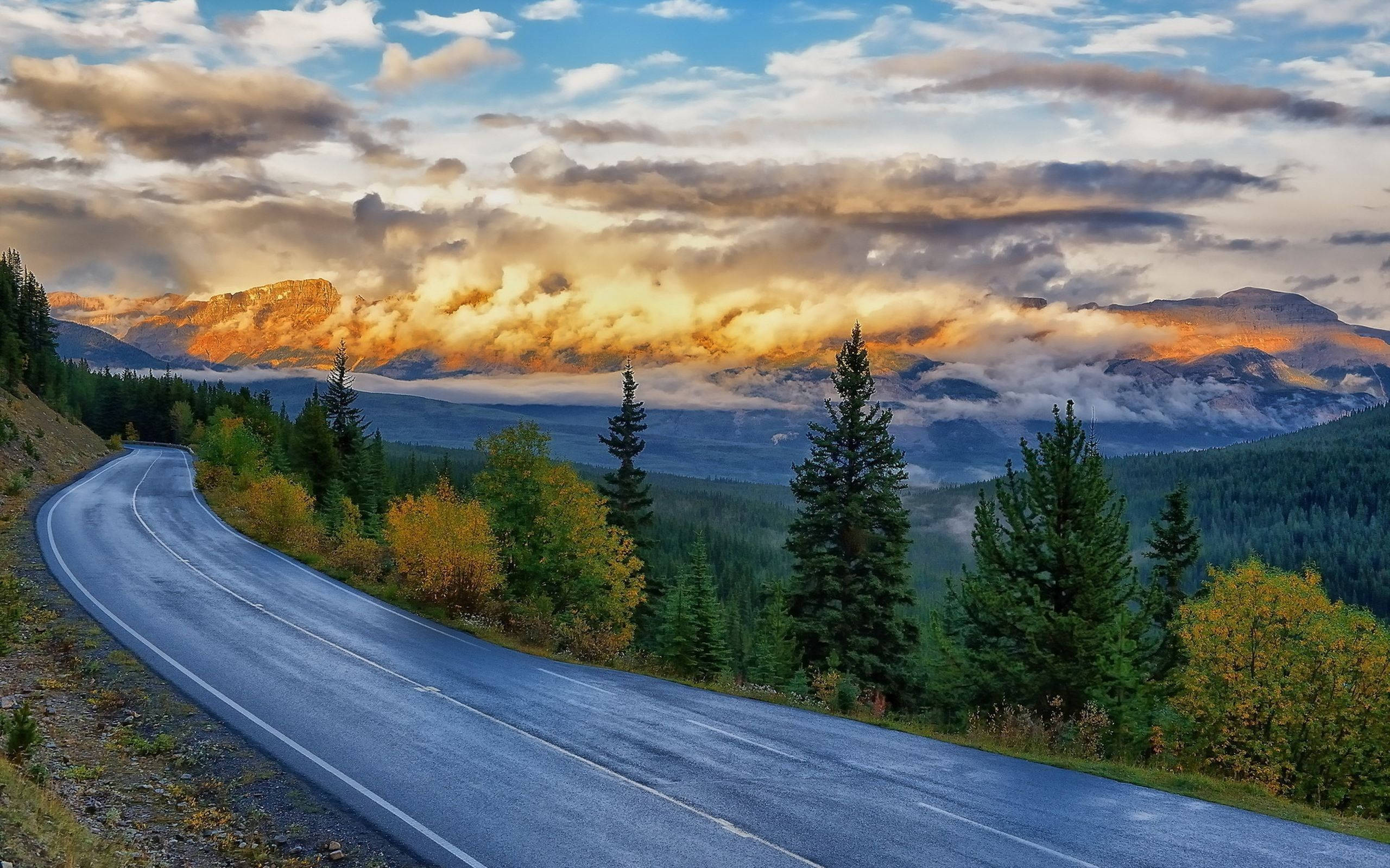 Slovakia, winding mountain road, autumn forests, 2K Desktop Wallpaper