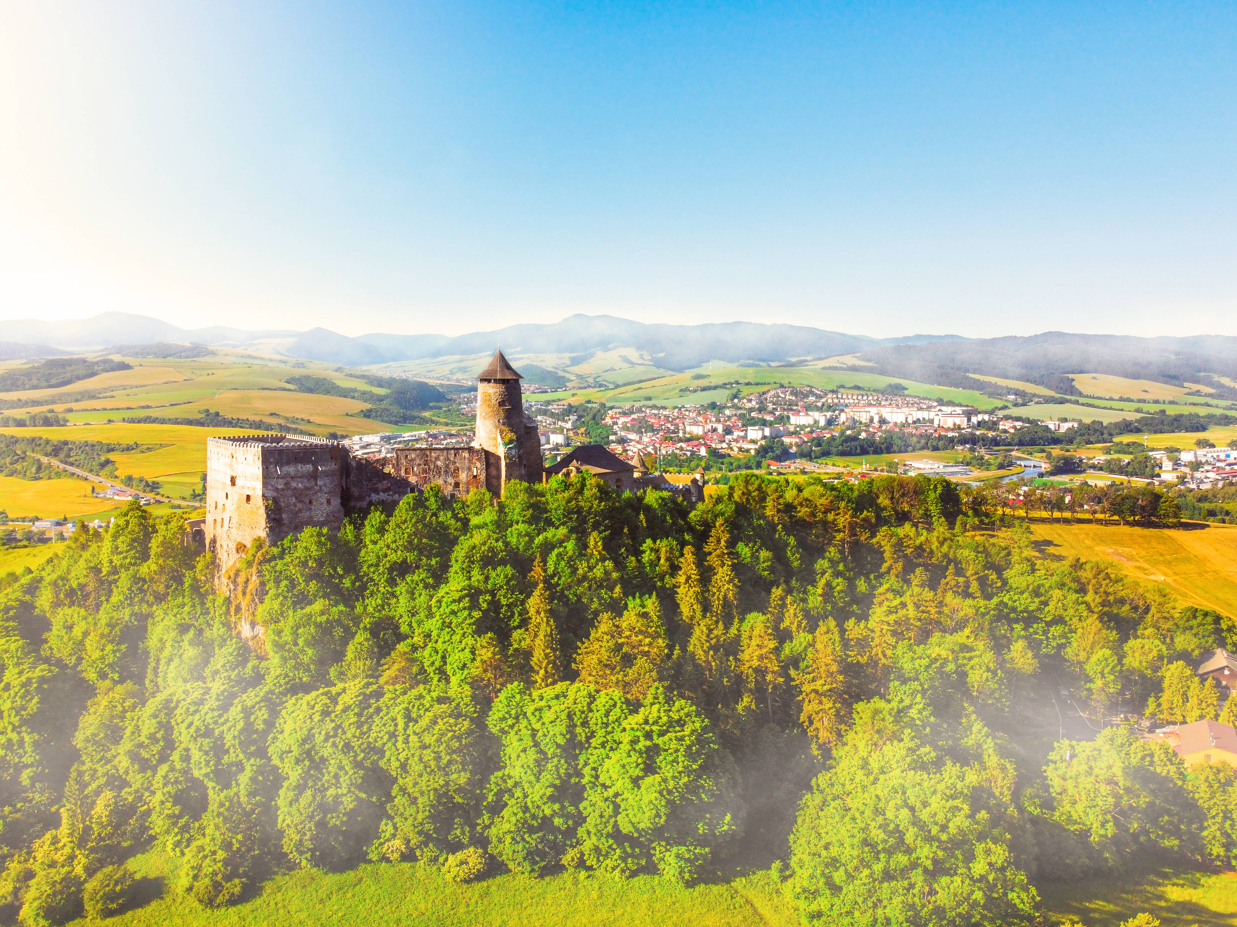 medieval castle, lush green hill, valley town, 4K Desktop Wallpaper
