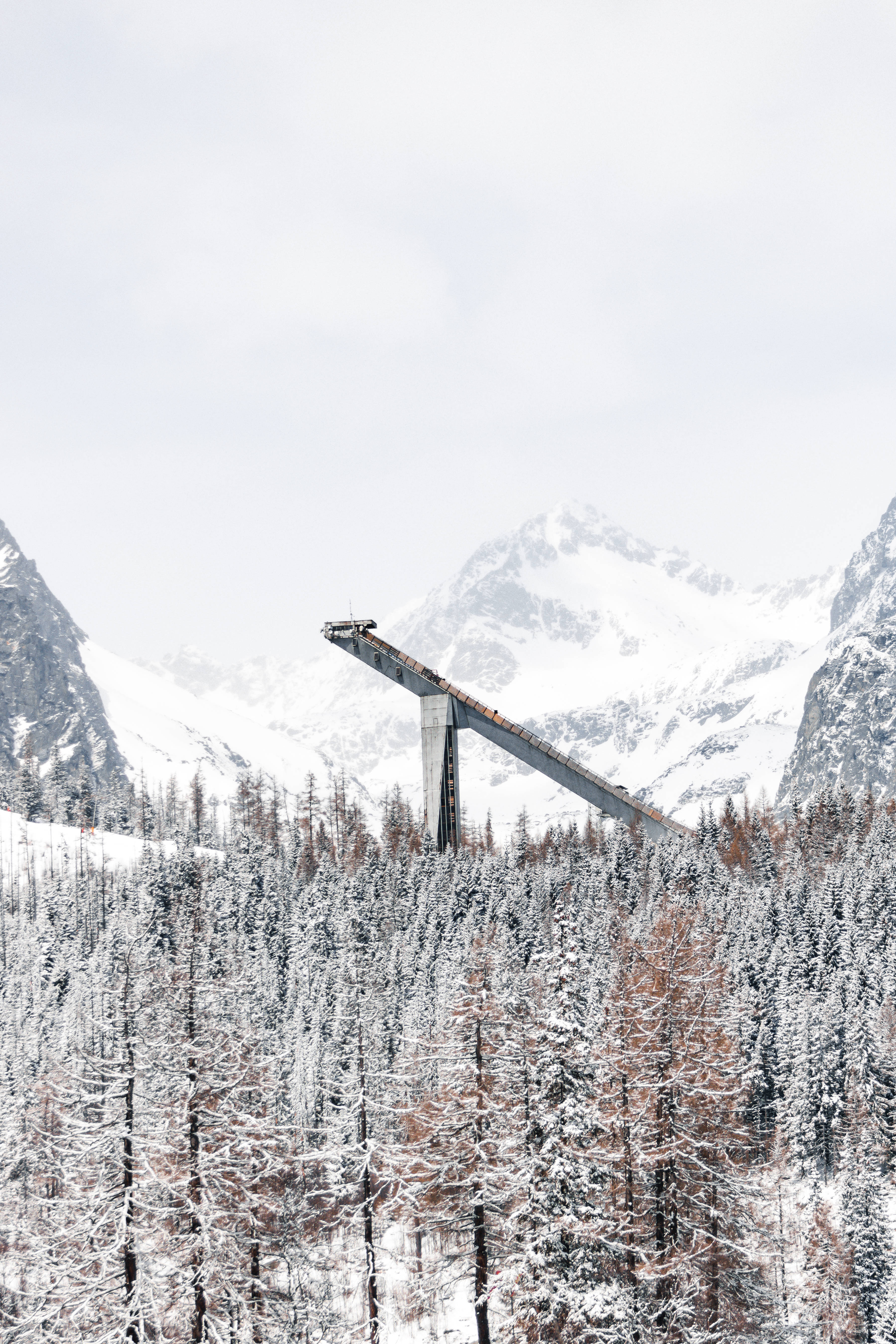 Slovakia, snow-covered ski jump, forested valley, 5K Phone Wallpaper