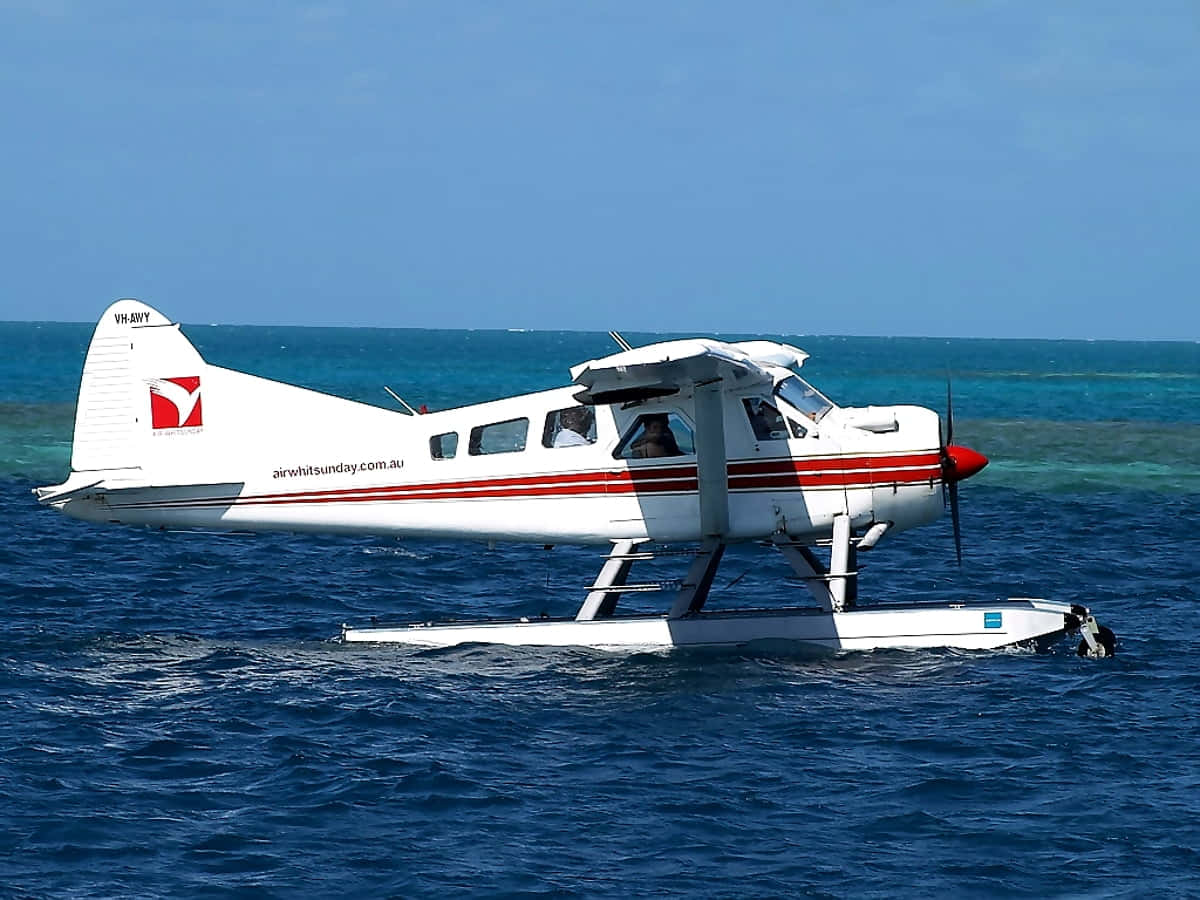 white seaplane, red stripes, turquoise ocean waters, SD Desktop Wallpaper
