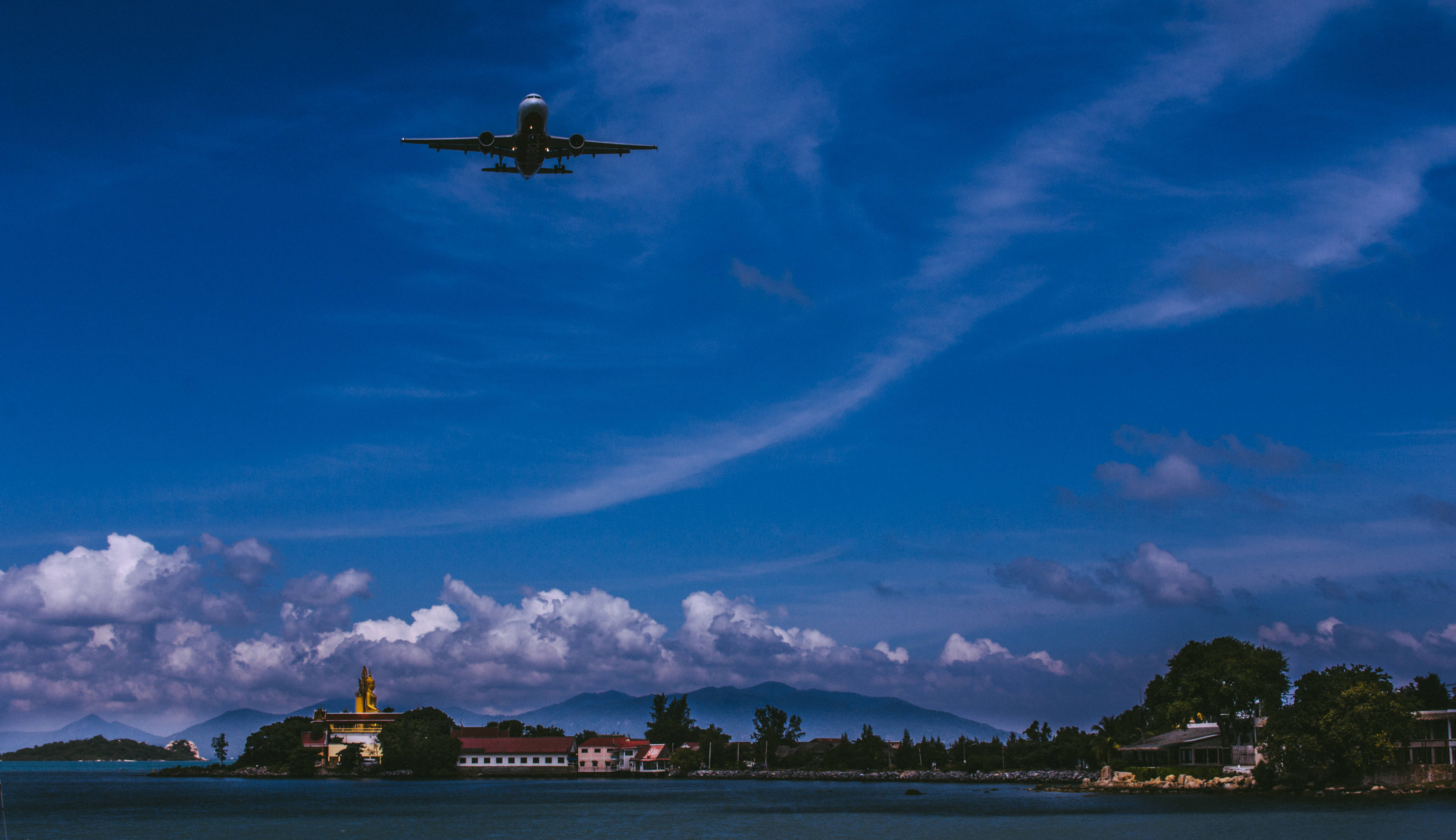 white passenger airplane, vibrant blue sky, scattered clouds, 4K Desktop Wallpaper