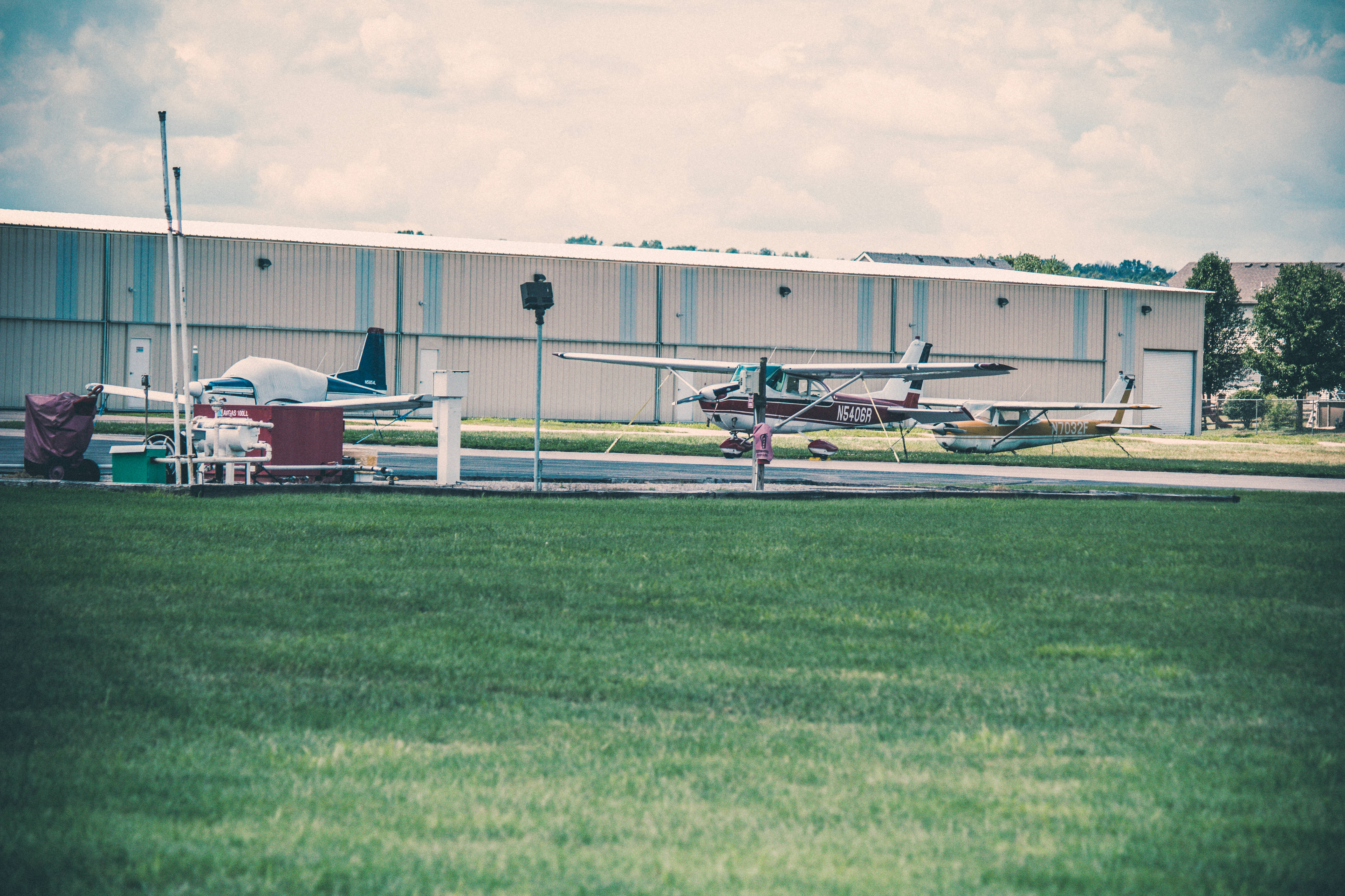 small plane, grassy field, hangar, 5K Desktop Wallpaper