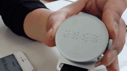 white smartwatch, raised braille dots, circular face, SD Desktop Wallpaper