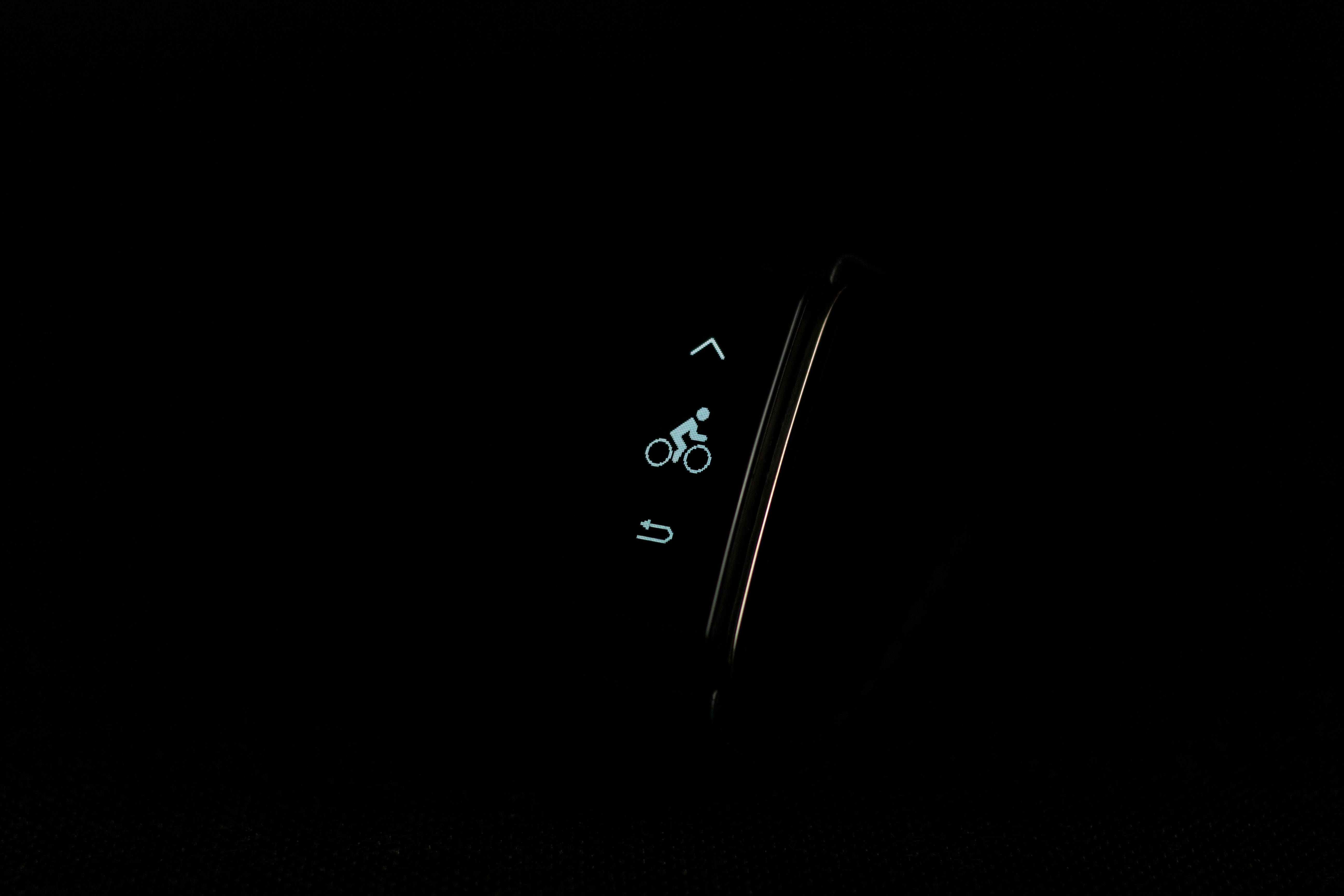 glowing blue bicycle icon, curved smartwatch screen, pitch black background, 5K Desktop Wallpaper