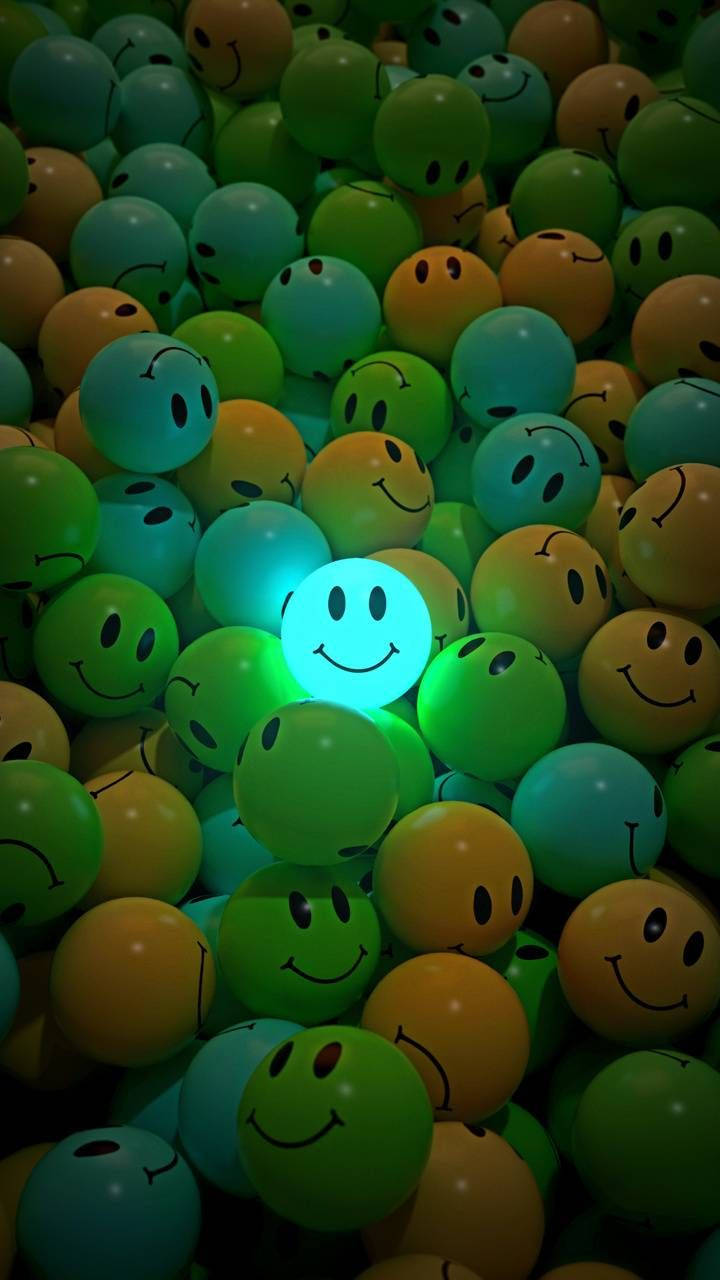 glowing blue smiley face ball, sea of green and yellow smiley balls, dark setting, HD Phone Wallpaper