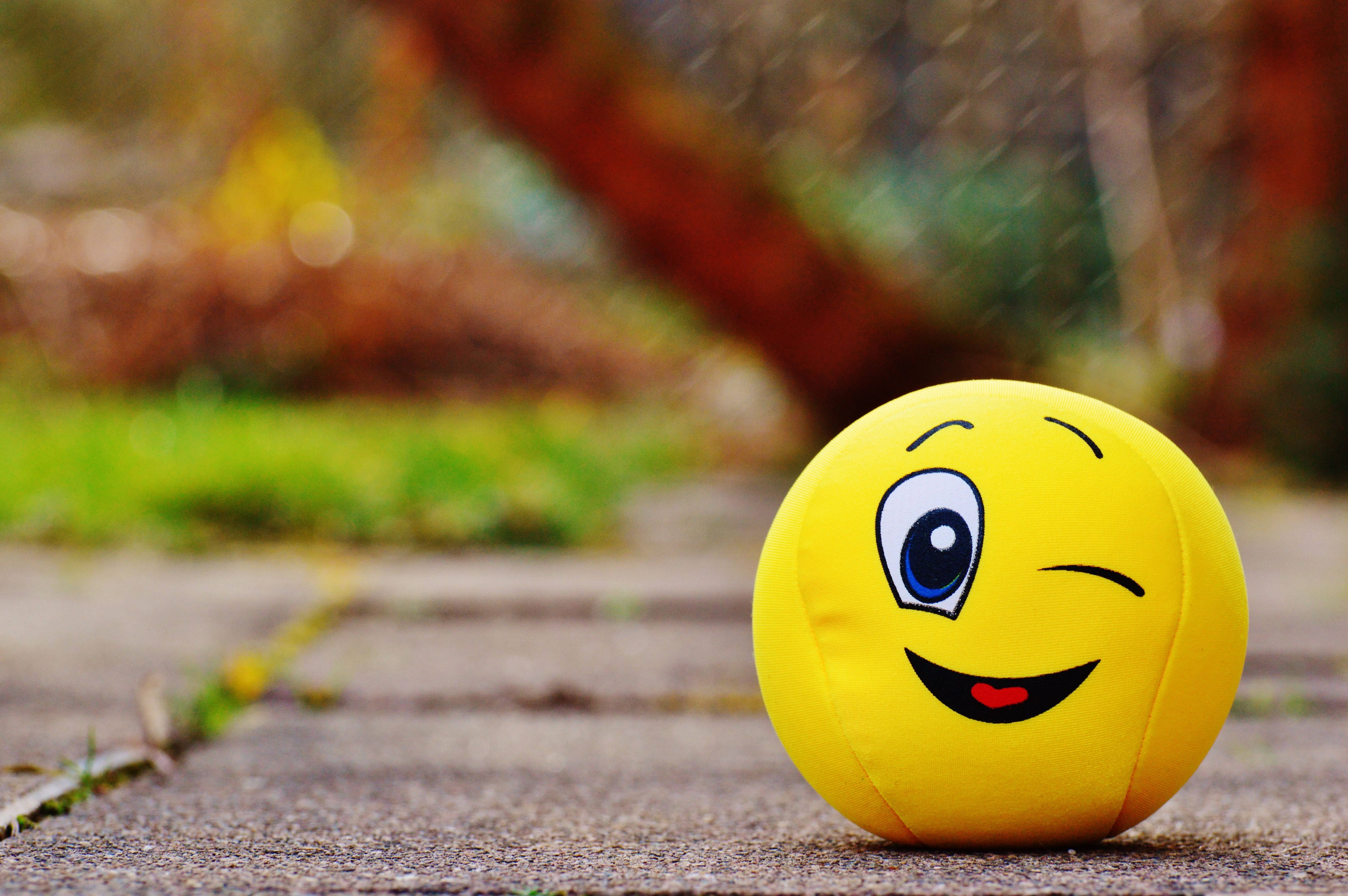 Happy Emoji Winking, yellow winking emoji plush ball, paved path, 5K Desktop Wallpaper