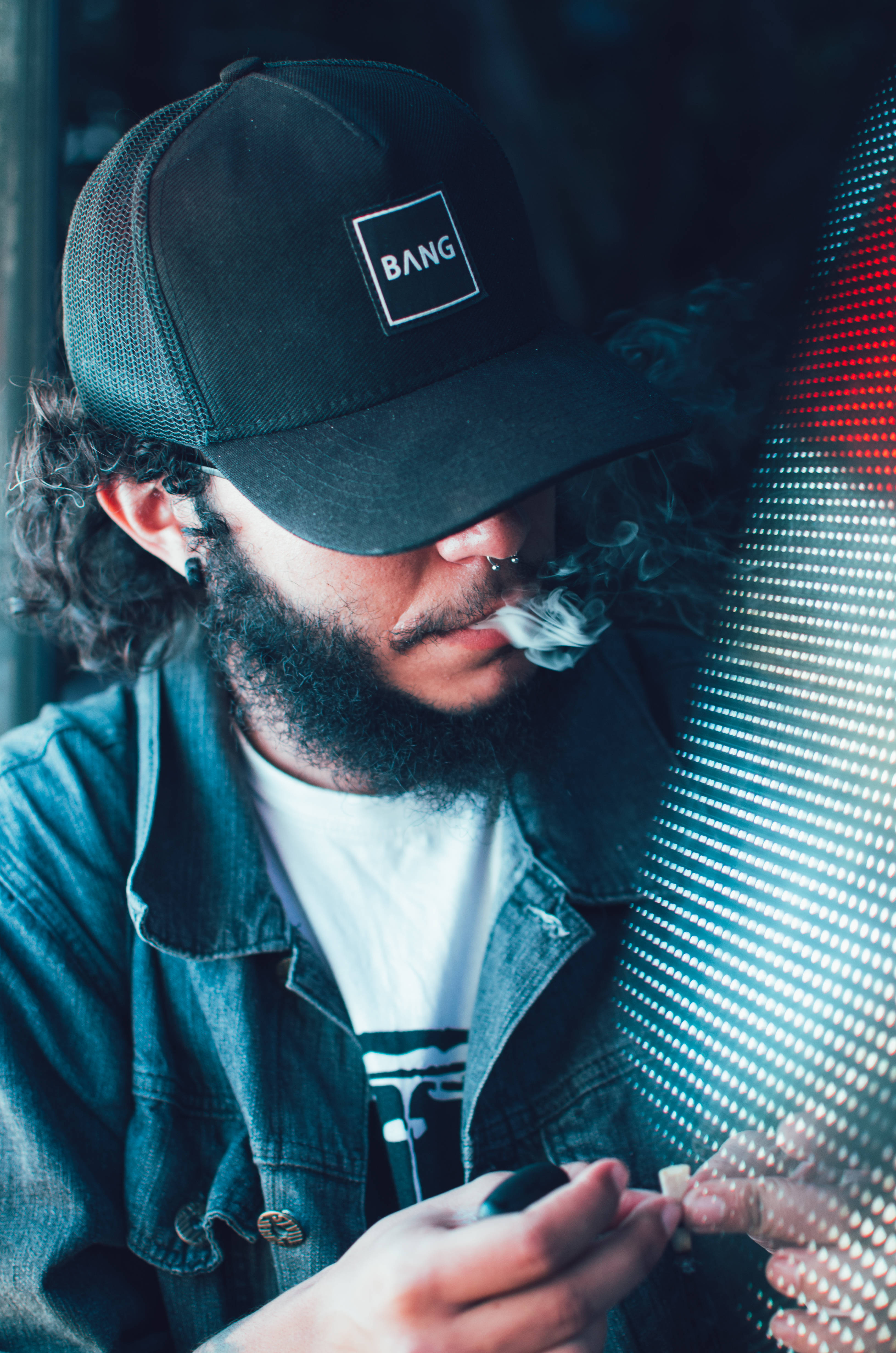 man in cap, vape device, glowing LED wall, 4K Phone Wallpaper