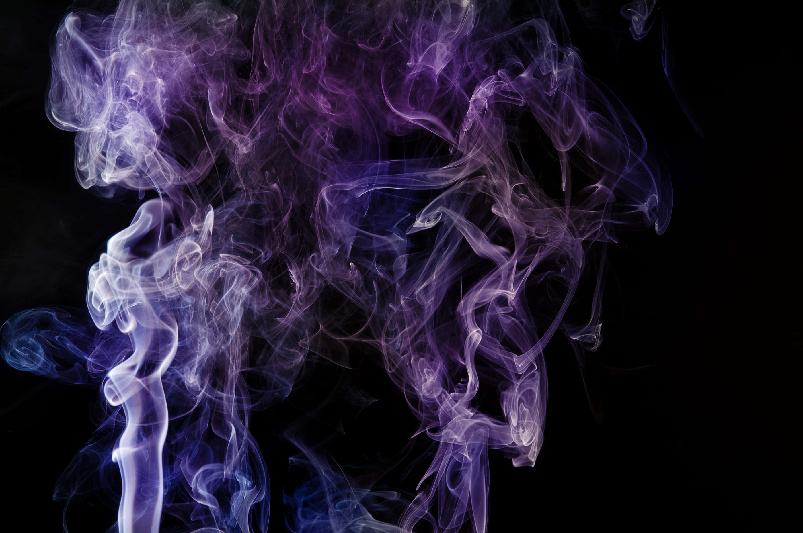 Ethereal purple and blue smoke, deep black background, mystical abstract composition, 2K Desktop Wallpaper