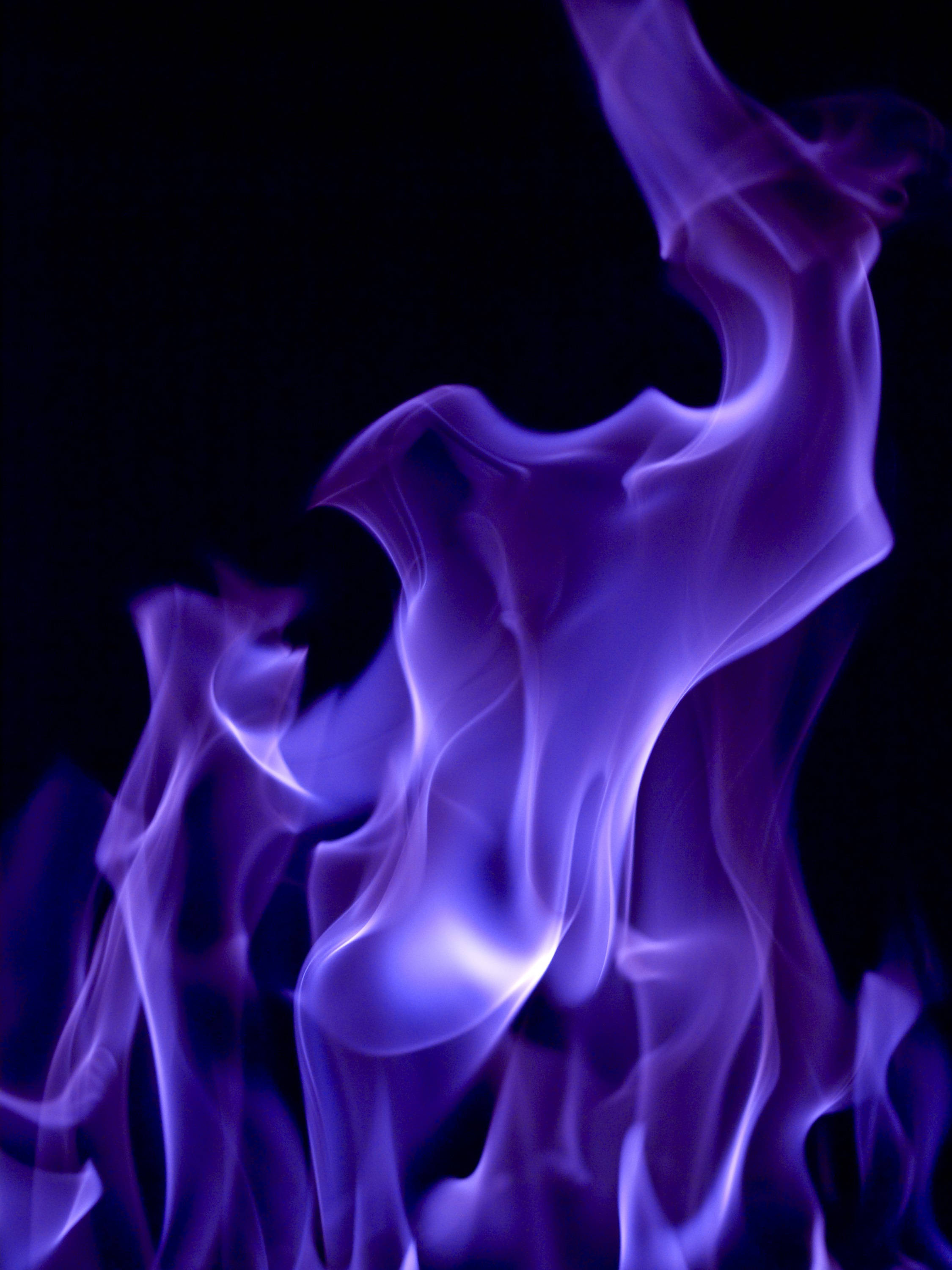 purple rising smoke, Vivid purple flames, pure black background, 2K Phone Wallpaper