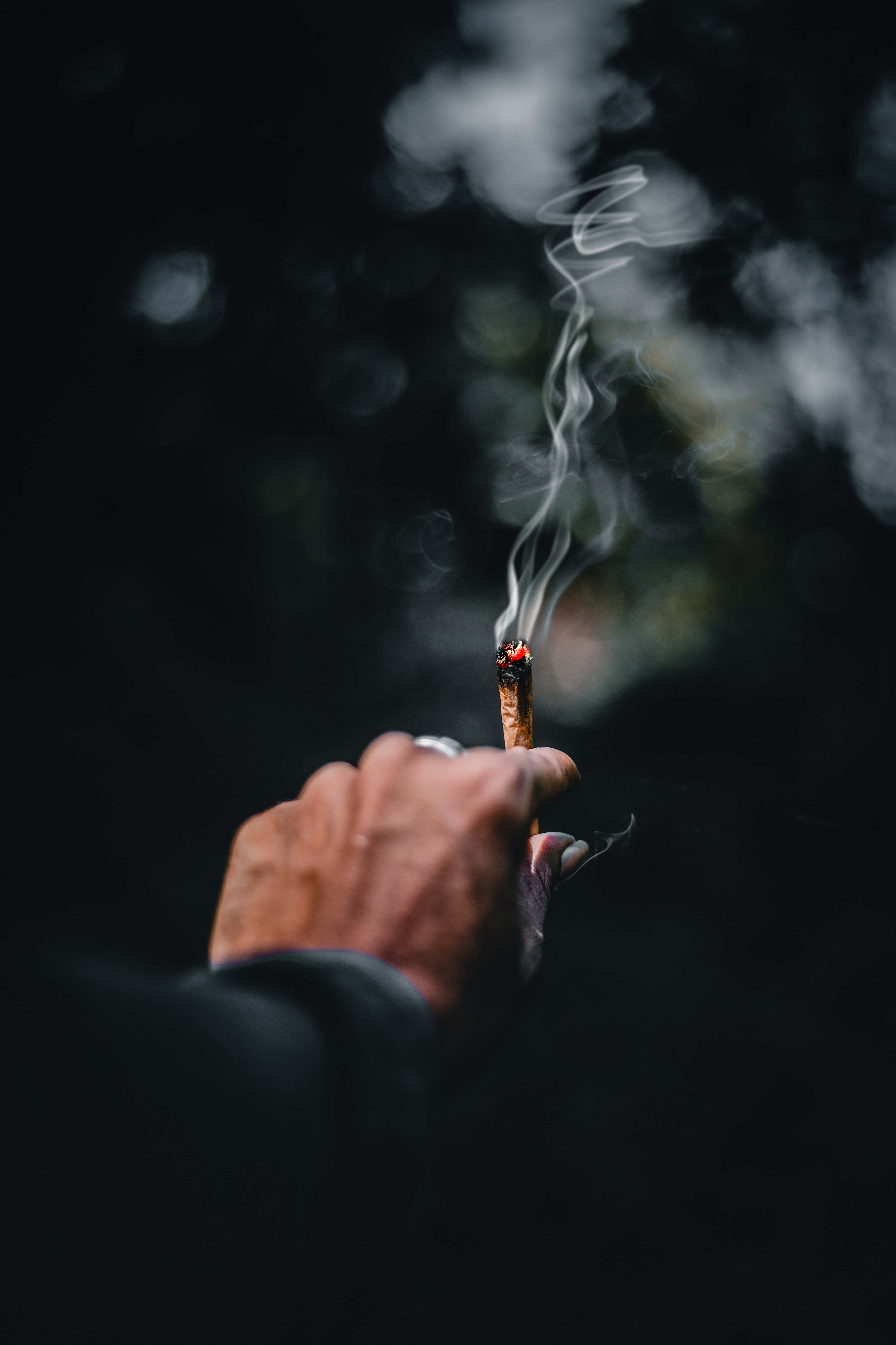 joint, lit cigarette, smoke curling upward, 5K Phone Wallpaper