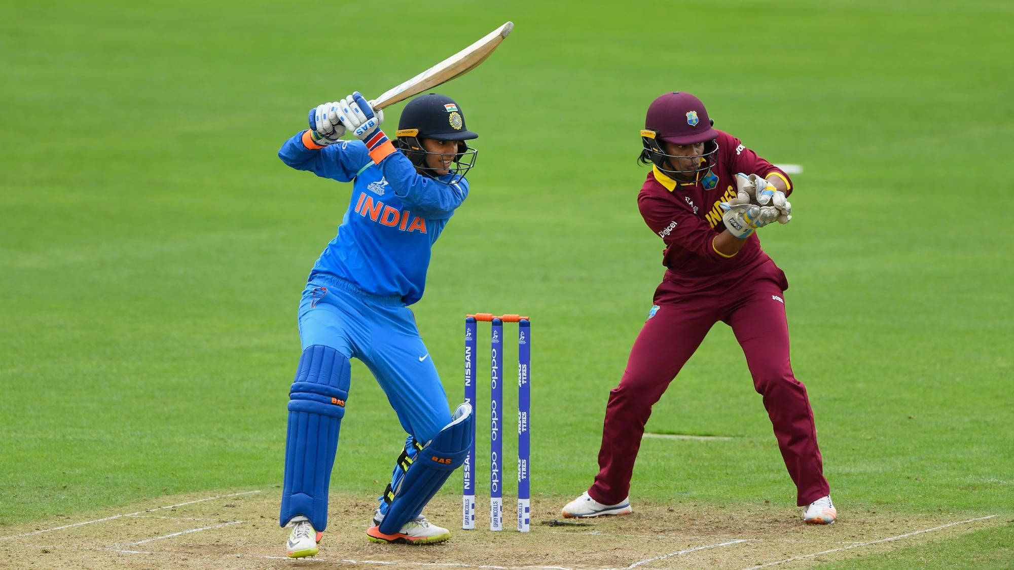 Smriti Mandhana, blue and maroon uniforms, vibrant green field, Full HD Desktop Wallpaper