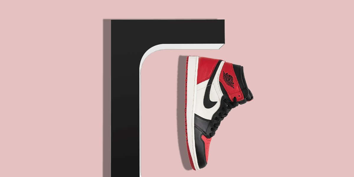 red black and white high-top sneaker, minimalist black and pink background, SD Desktop Wallpaper