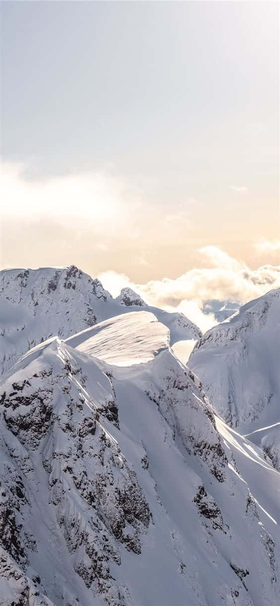 Snow iPhone, snowcapped mountain peaks, soft clouds, SD Phone Wallpaper