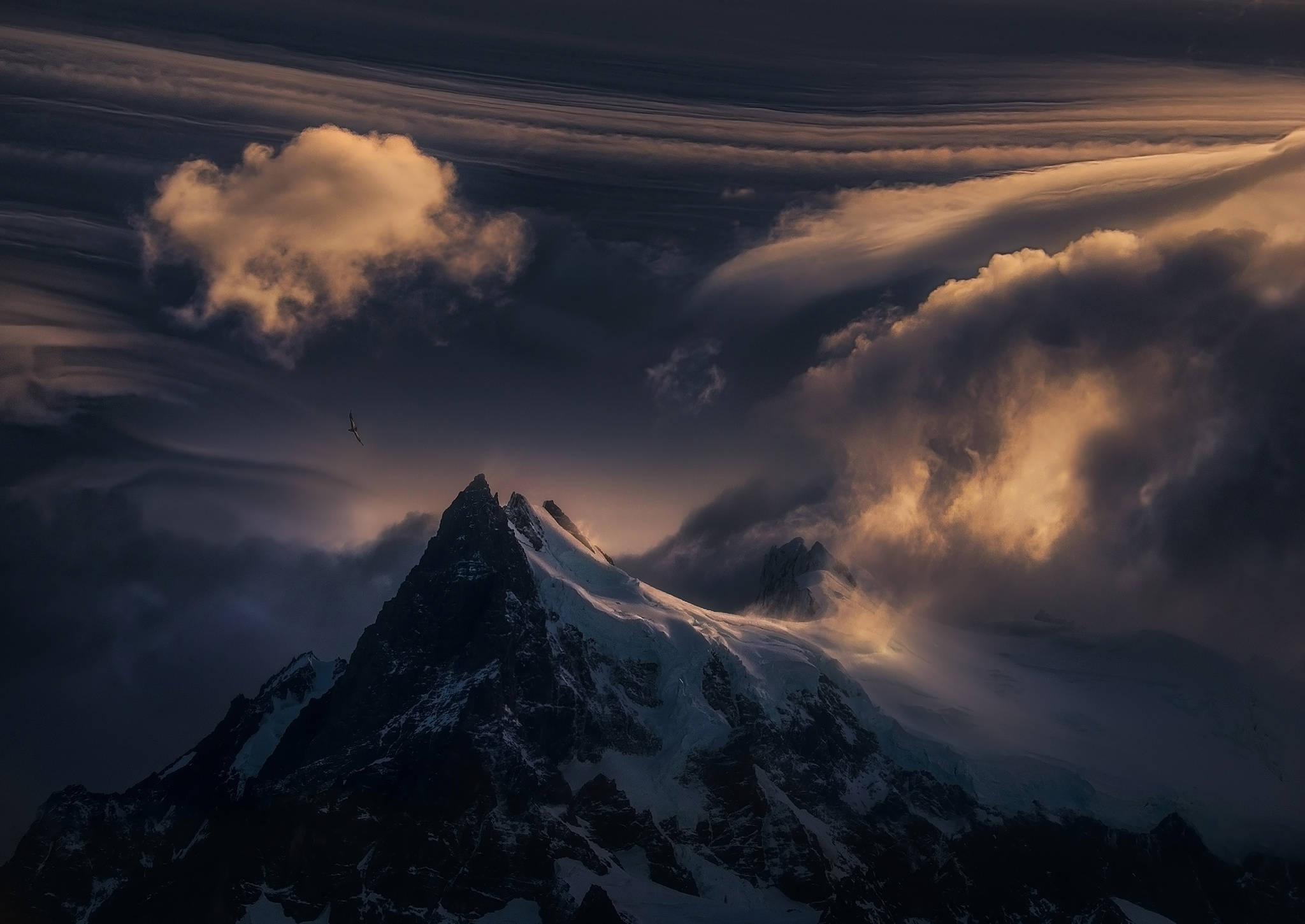 snowcapped mountain peak, dramatic clouds, golden sunset light, Full HD Desktop Wallpaper