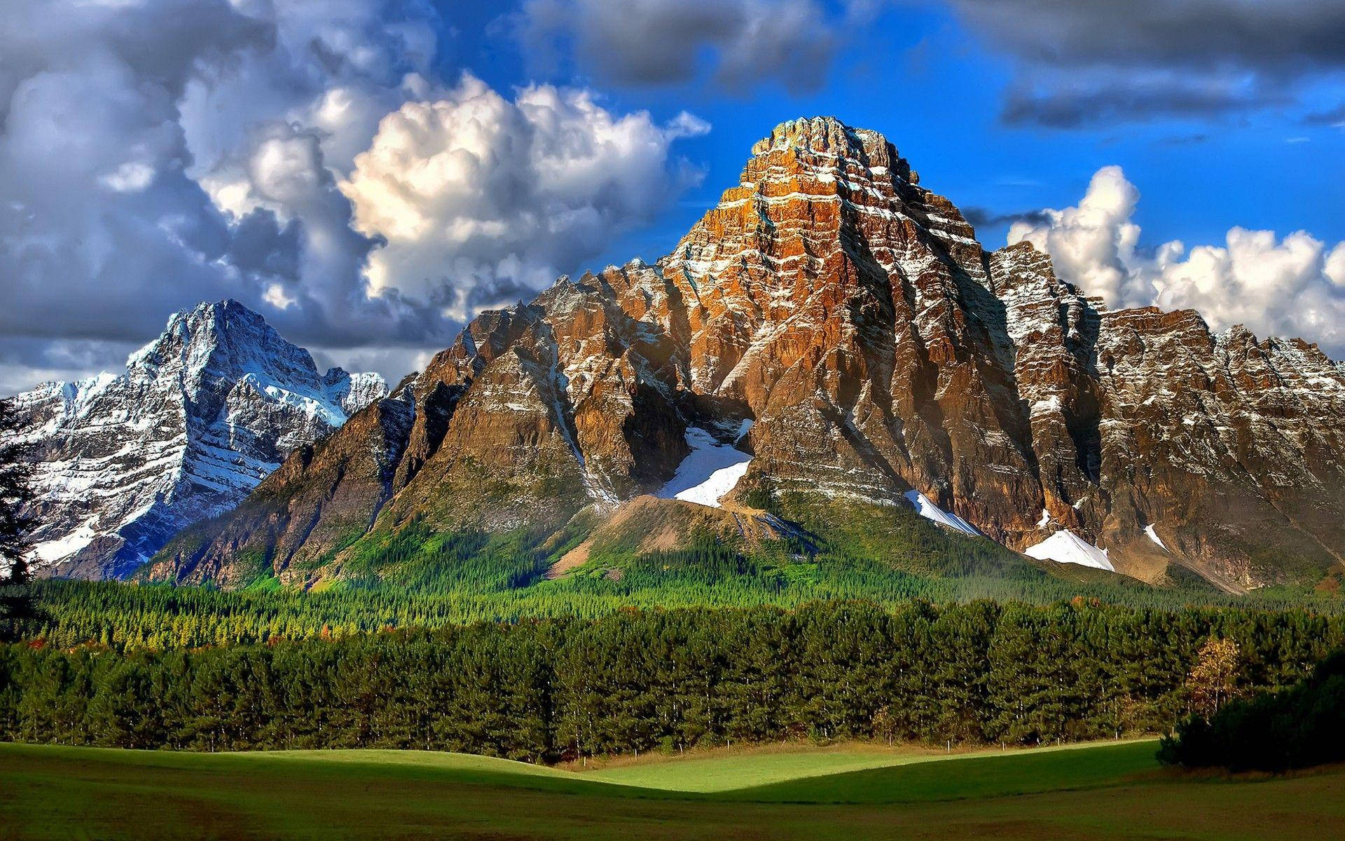 Snow-Tipped Rocky Mountain, snow-capped peaks, rugged cliffs, Full HD Desktop Wallpaper
