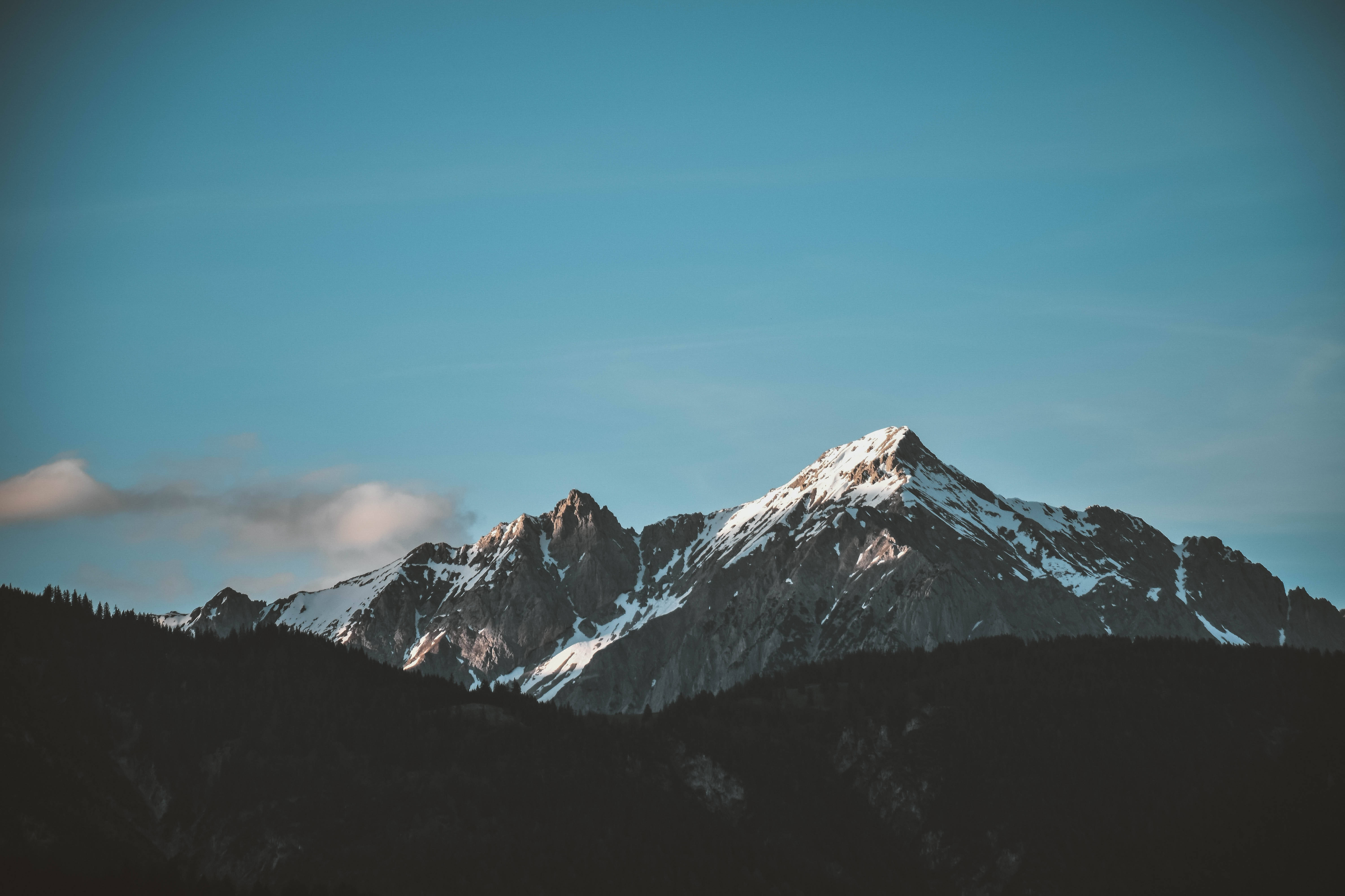 snow-capped mountain peak, clear blue sky, soft clouds, 5K Desktop Wallpaper