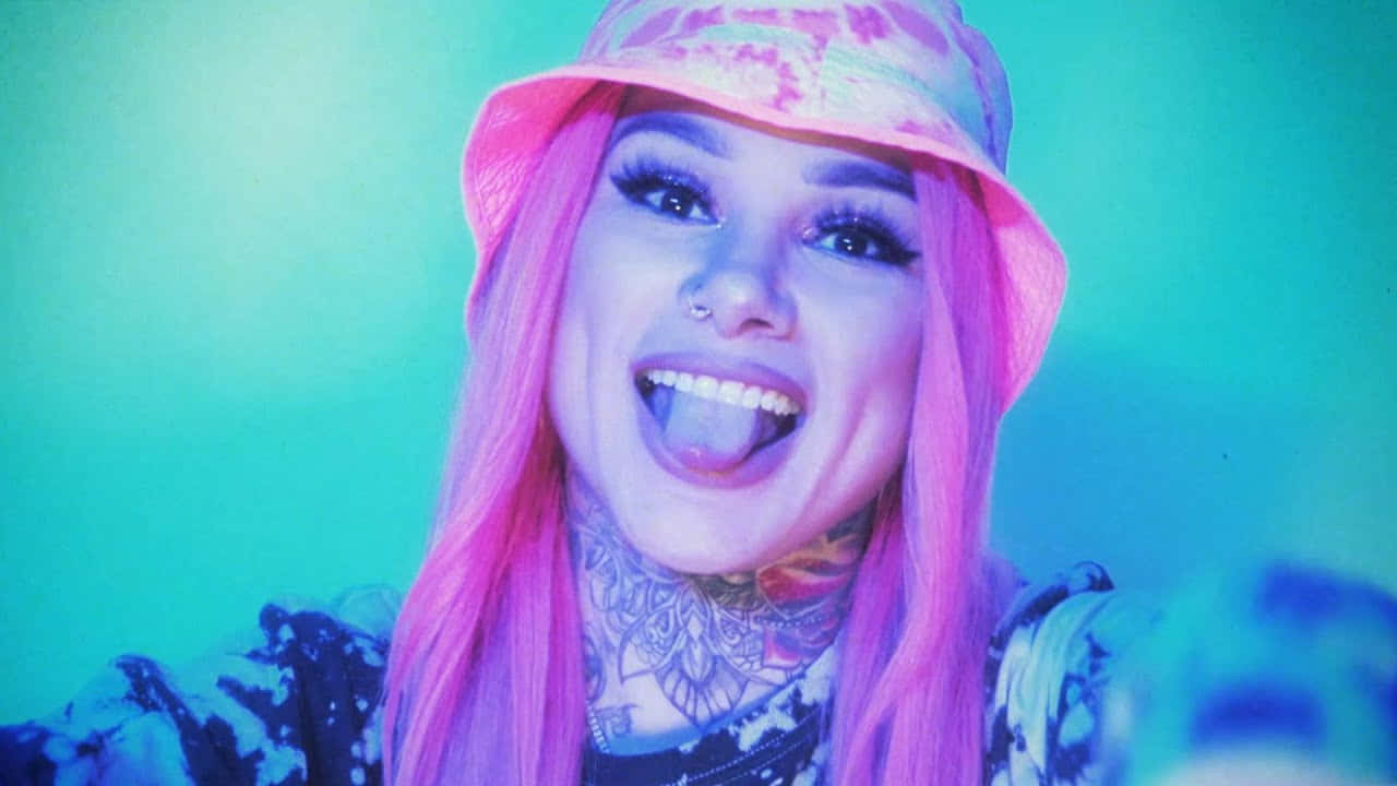 vibrant pink hair, tie-dye hat, glowing teal background, HD Desktop Wallpaper