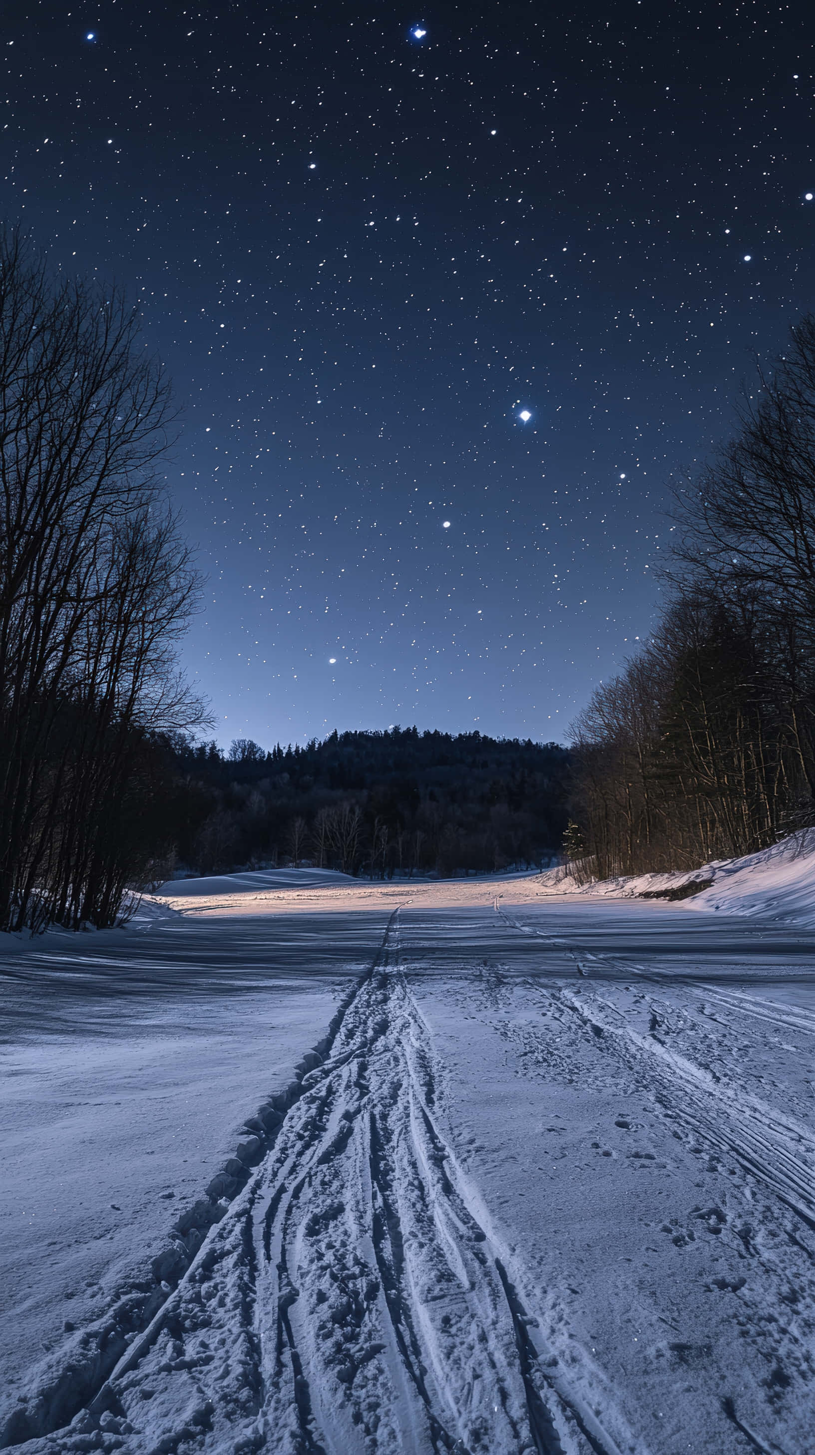 snow-covered ground, ski tracks, starry night sky, 2K Phone Wallpaper