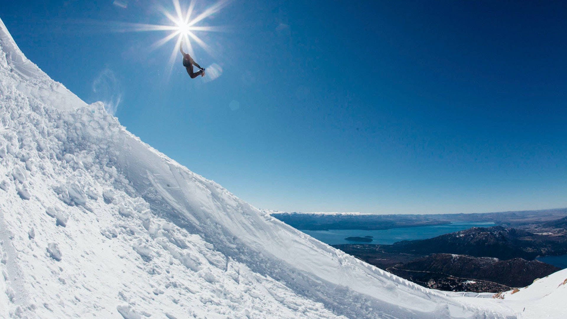 snowboarding, sunlit snowy slope, blue lake, Full HD Desktop Wallpaper