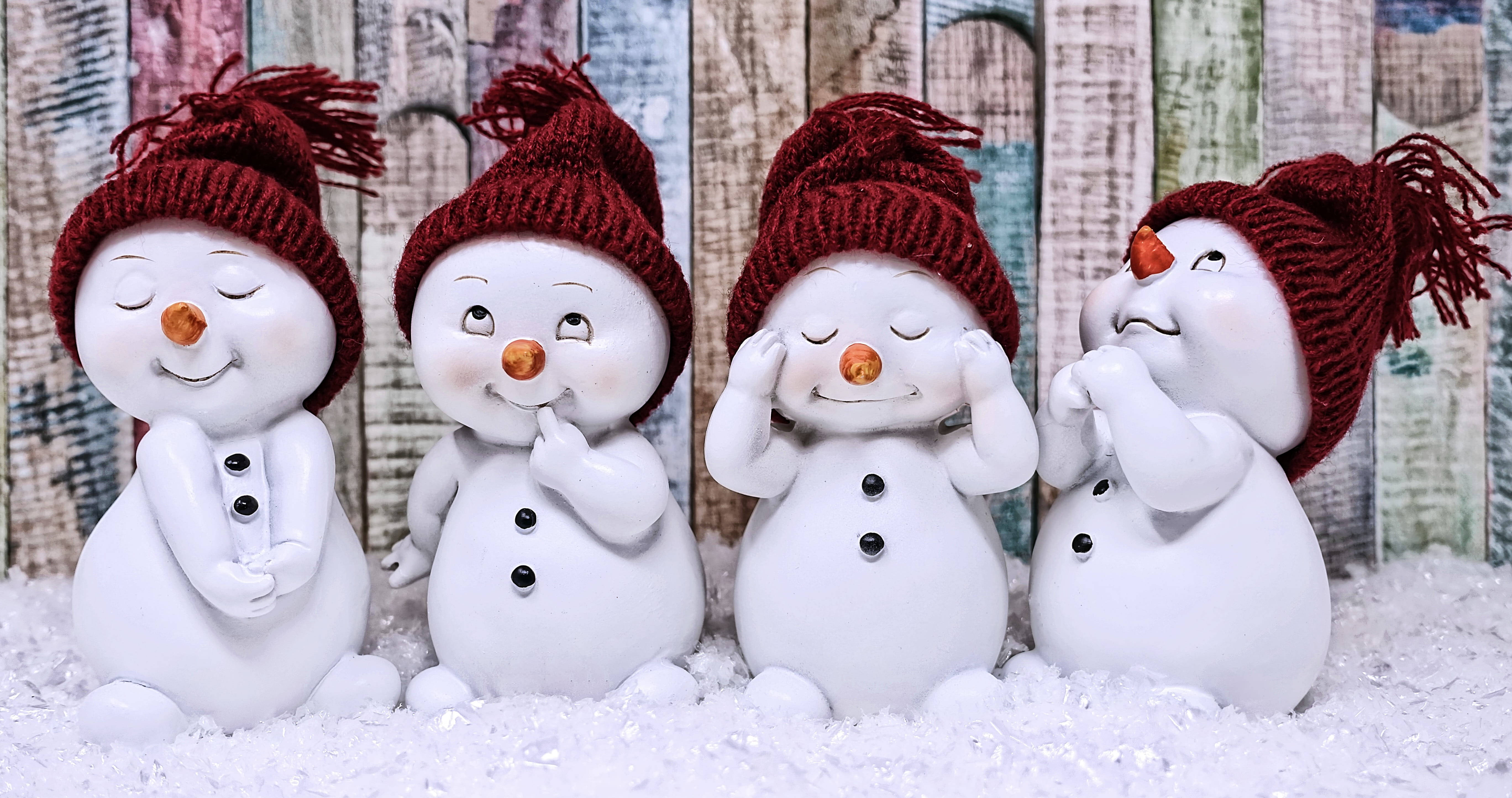 ceramic snowman figurines, red knit hats, snowy foreground, 5K Desktop Wallpaper