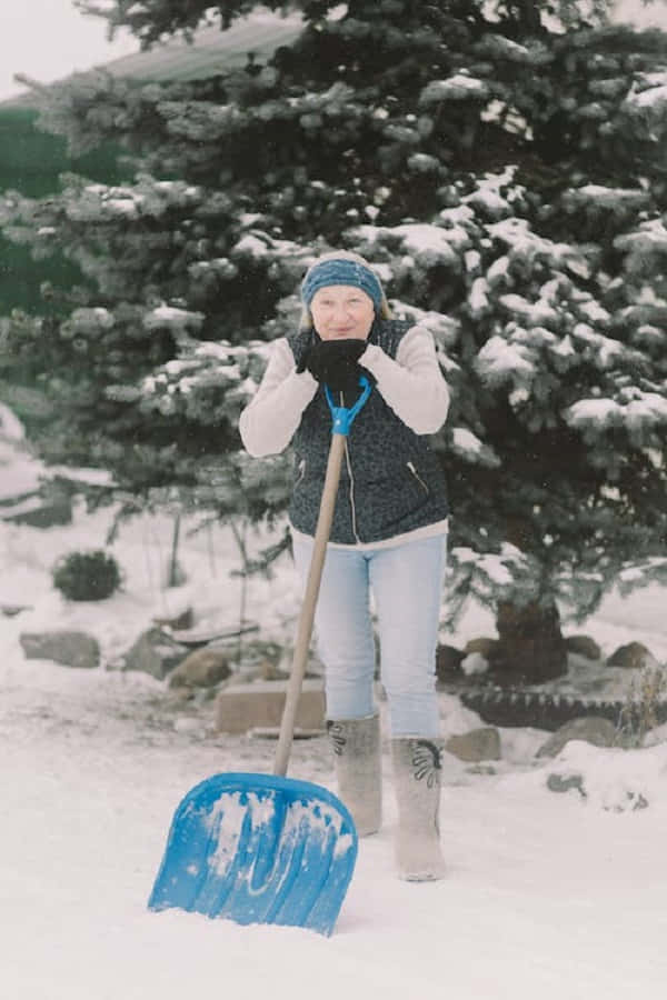 Snowshoes, snowy mountain trail, blue snow shovel, SD Phone Wallpaper