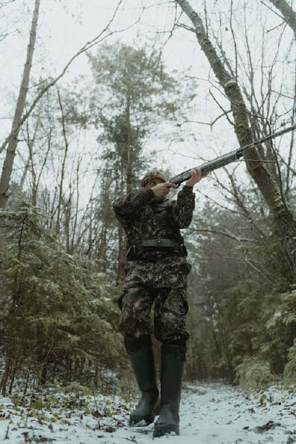 Snowshoes, camouflage gear, shotgun, SD Phone Wallpaper