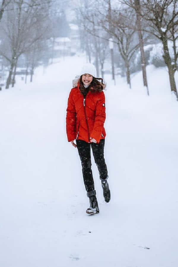 snowshoes, bright red winter coat, white beanie, SD Phone Wallpaper