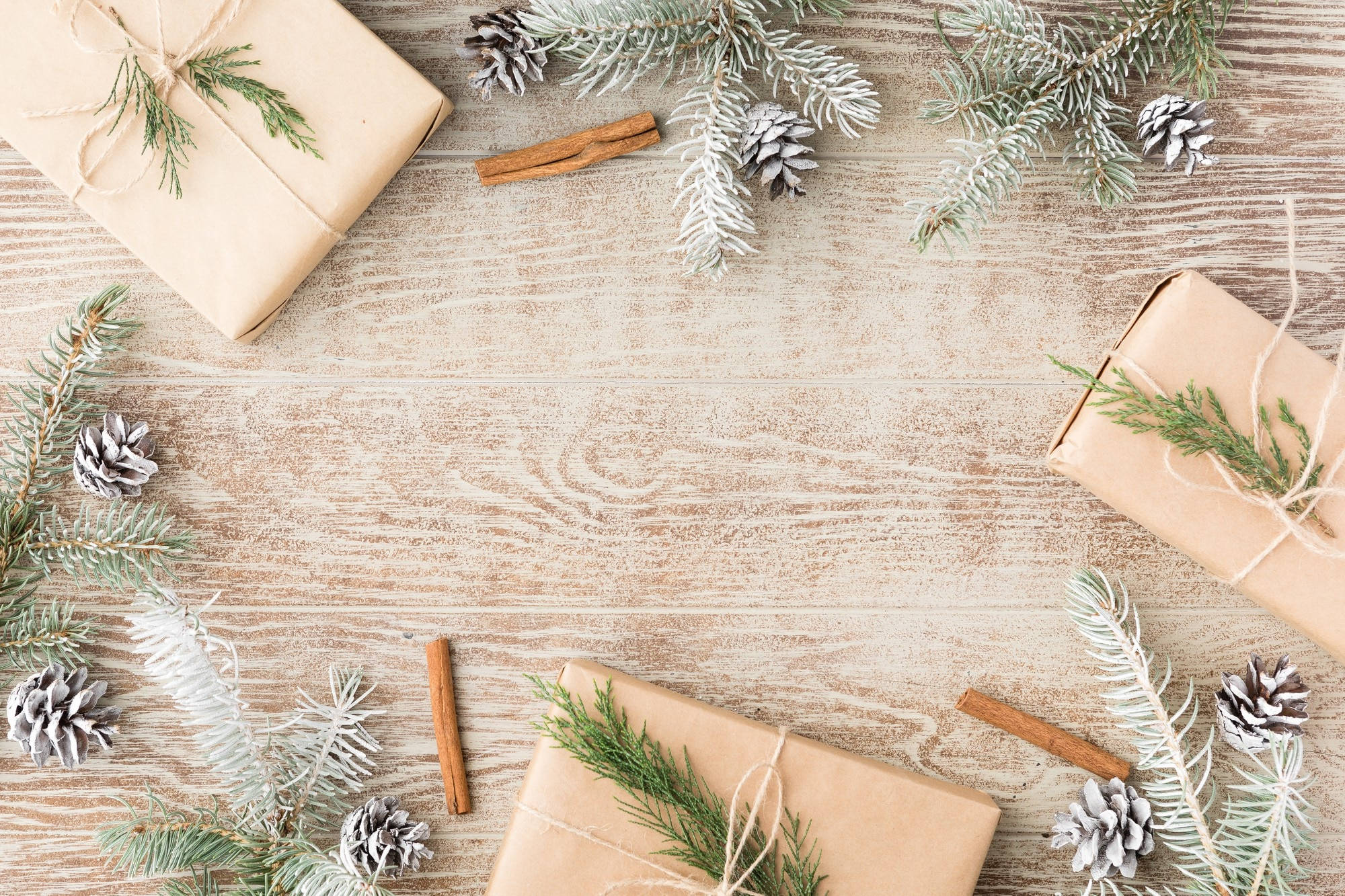 Snowy Christmas Table, rustic brown gift boxes, evergreen sprigs, Full HD Desktop Wallpaper