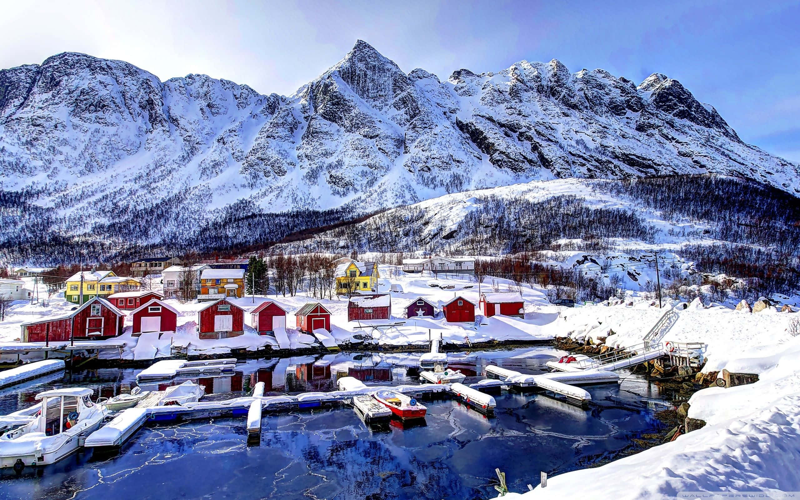 Snowy Village, red fishing huts, frozen harbor, 2K Desktop Wallpaper