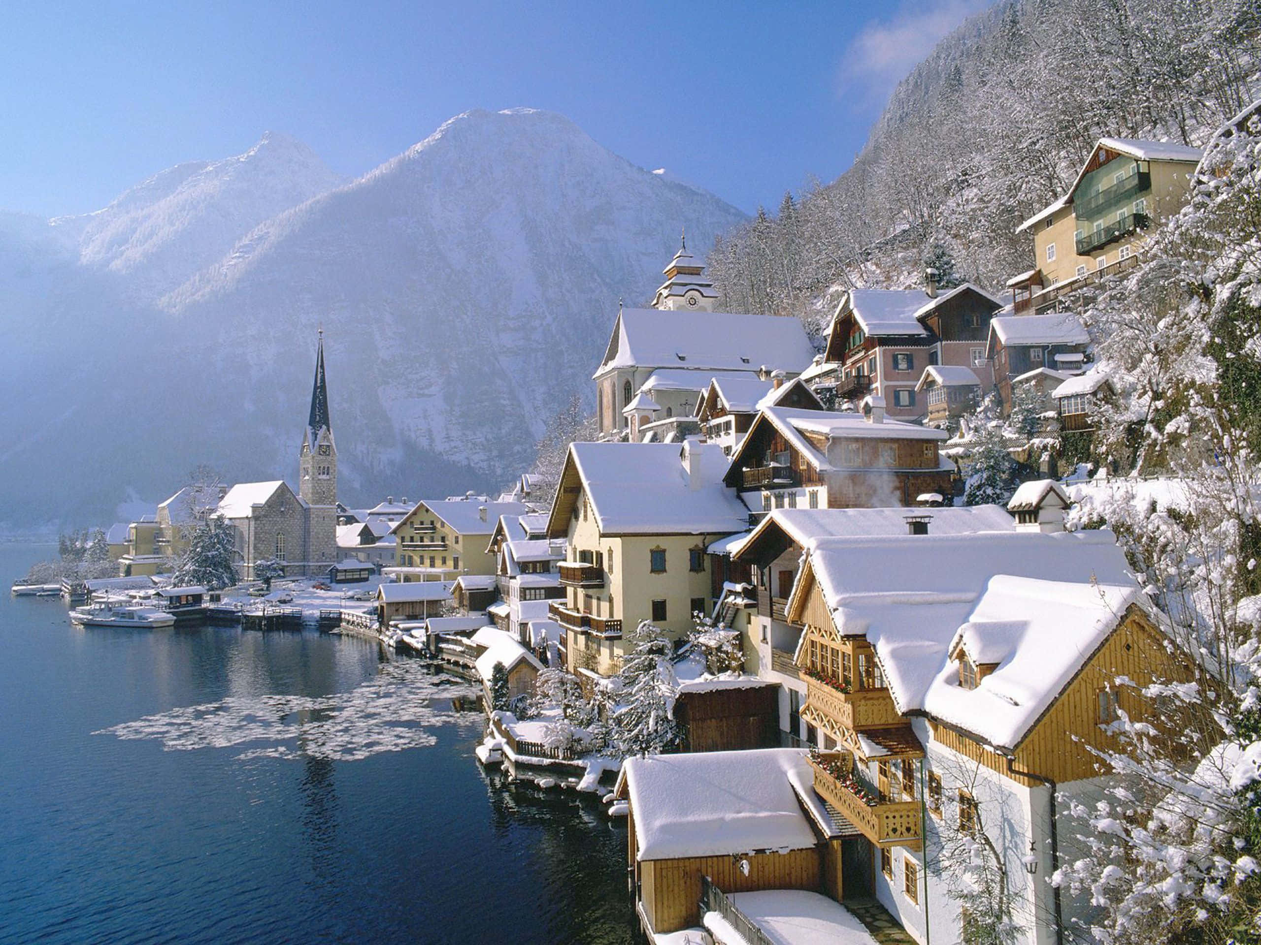 Snowy Village, alpine houses, serene lake, 2K Desktop Wallpaper